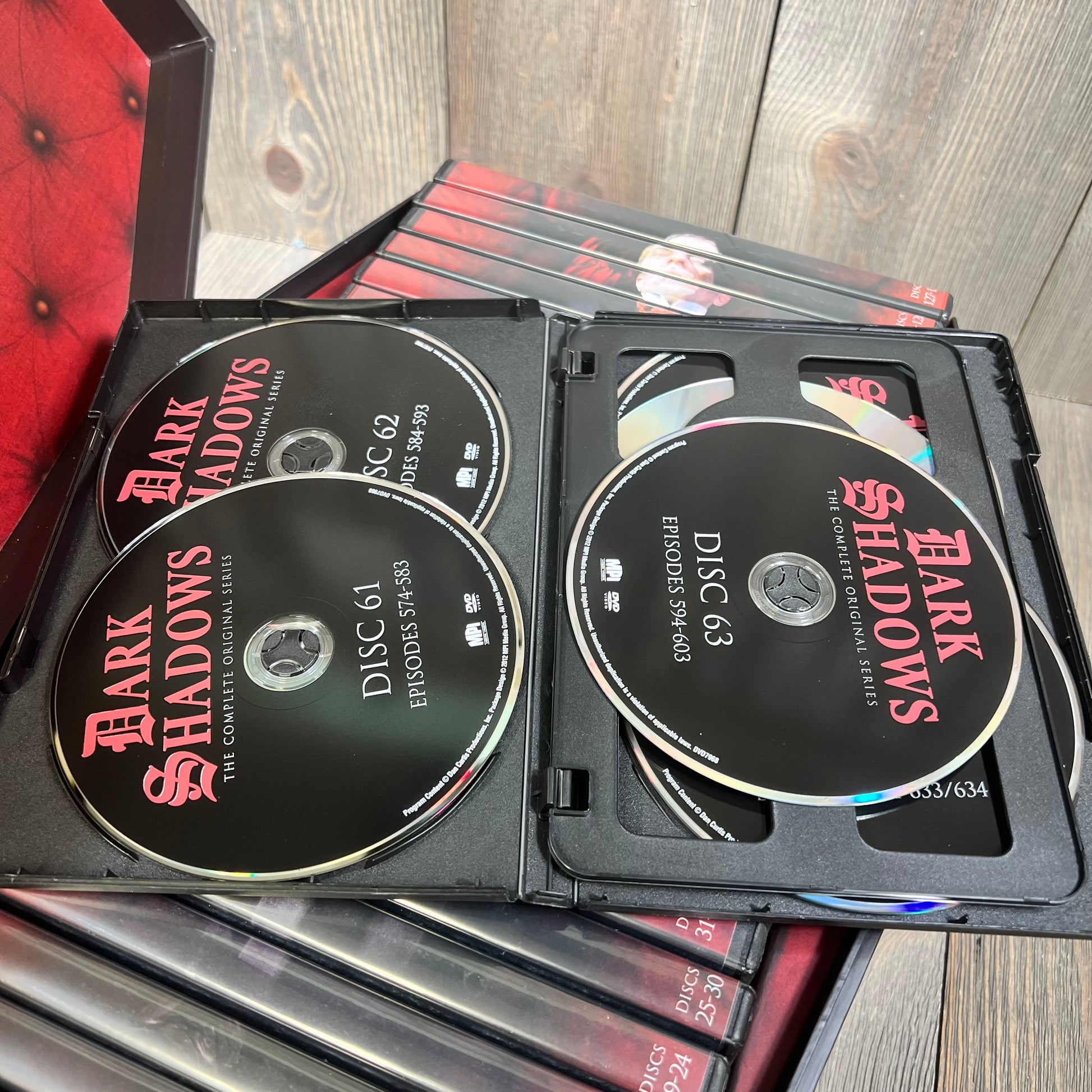 Alt text: "Dark Shadows: The Complete Original Series Deluxe Edition DVD set with multiple discs displayed in an open case."