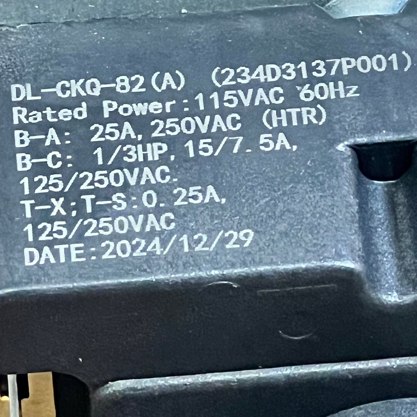 Close-up view of OEM dryer timer replacement, model 234D2377P005, showcasing specifications and date for GE dryers.