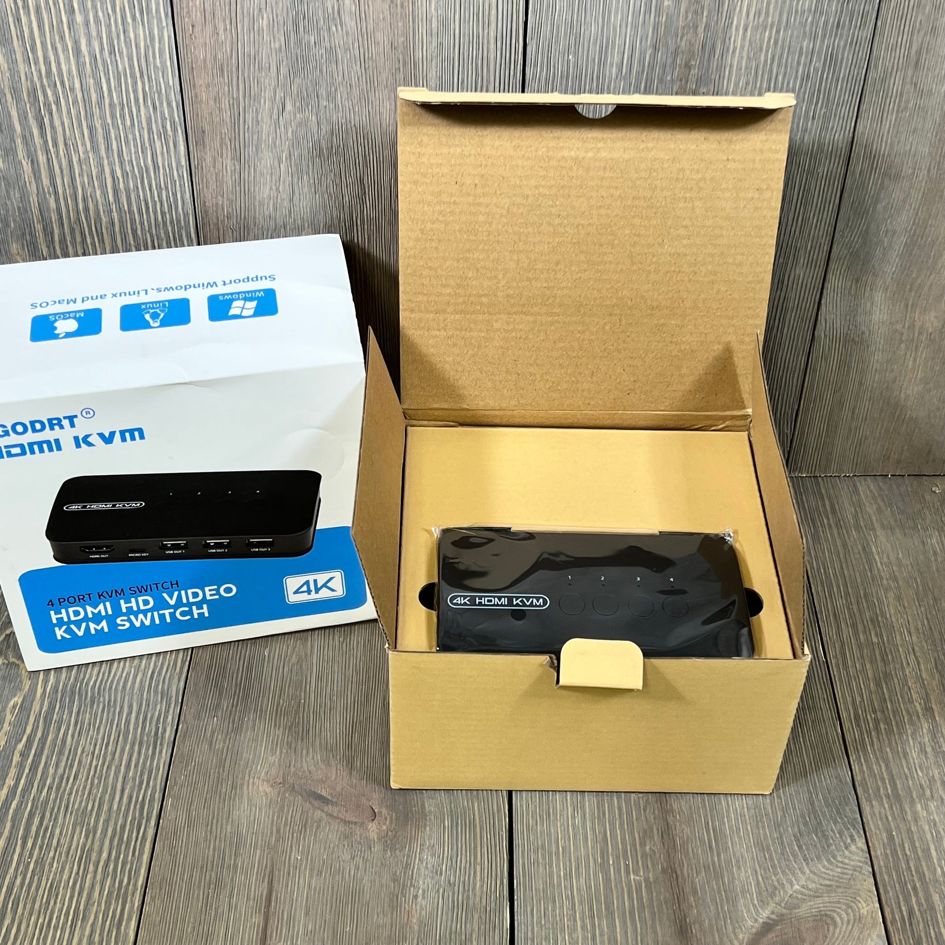 4K HDMI KVM Switch in packaging, showcasing 4-port design for sharing monitor and USB devices, includes KVM cables.
