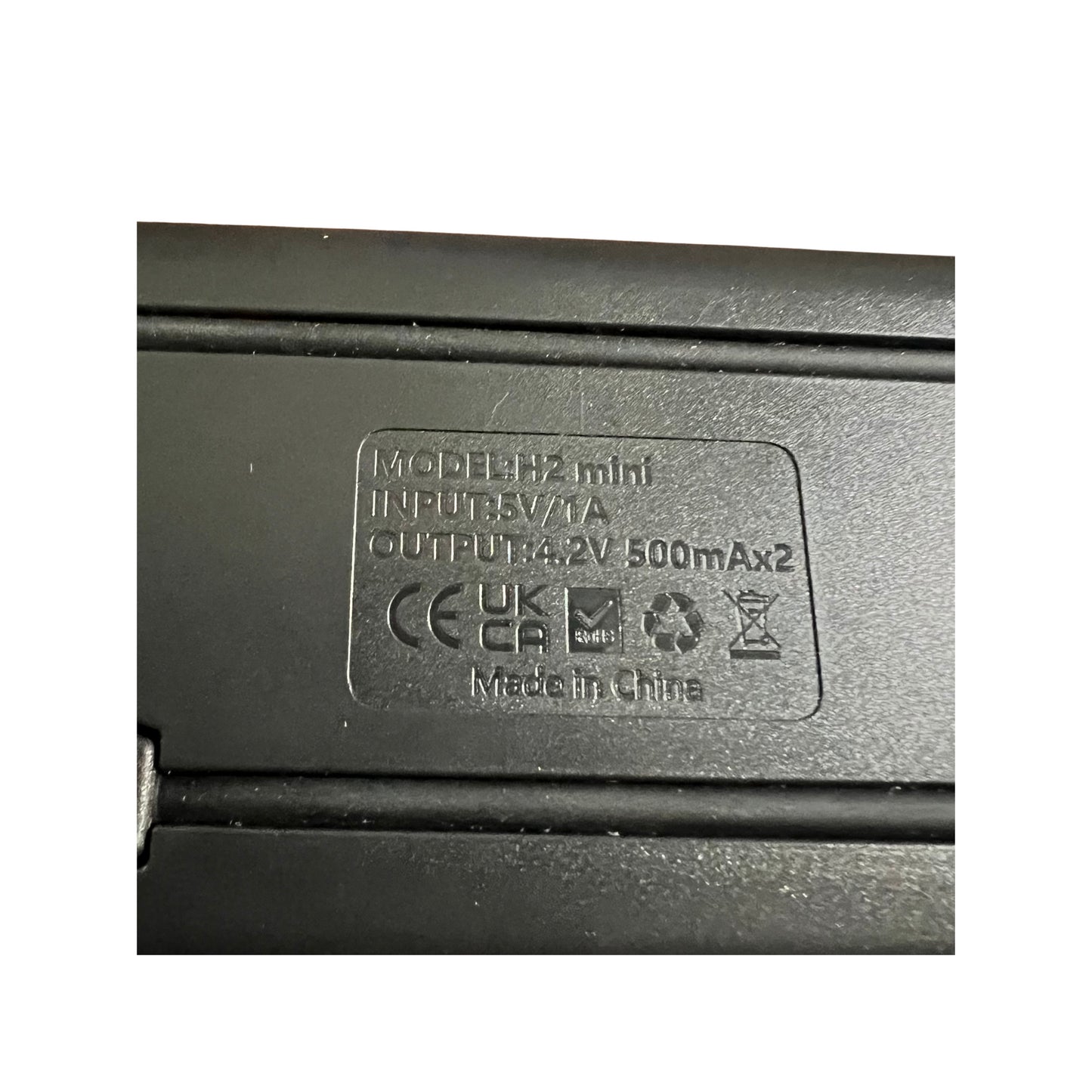 Dual charger close-up for NP-BN1 batteries, showcasing input/output details, perfect for Sony camera accessories.