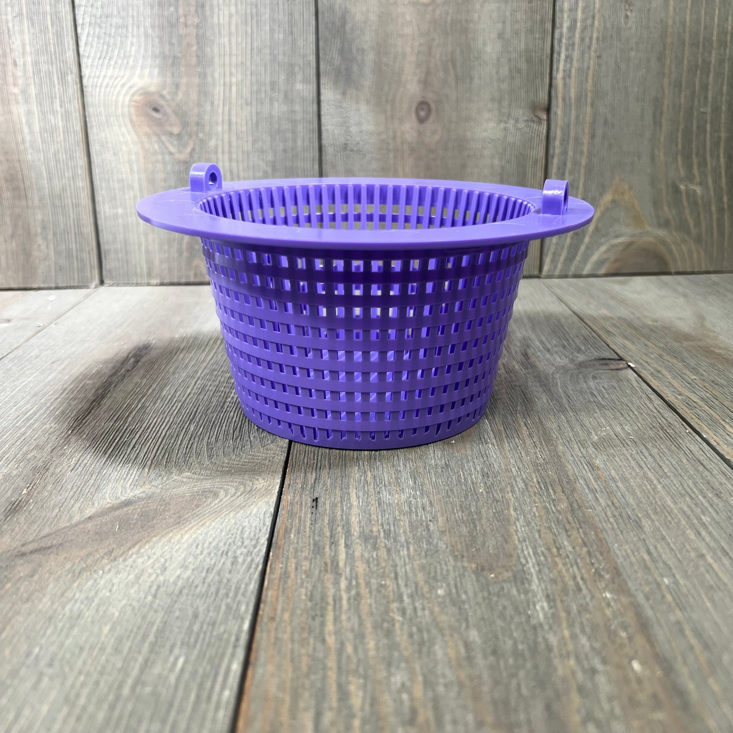 Purple pool skimmer basket with handle, 6.18" top diameter, on a wooden surface.