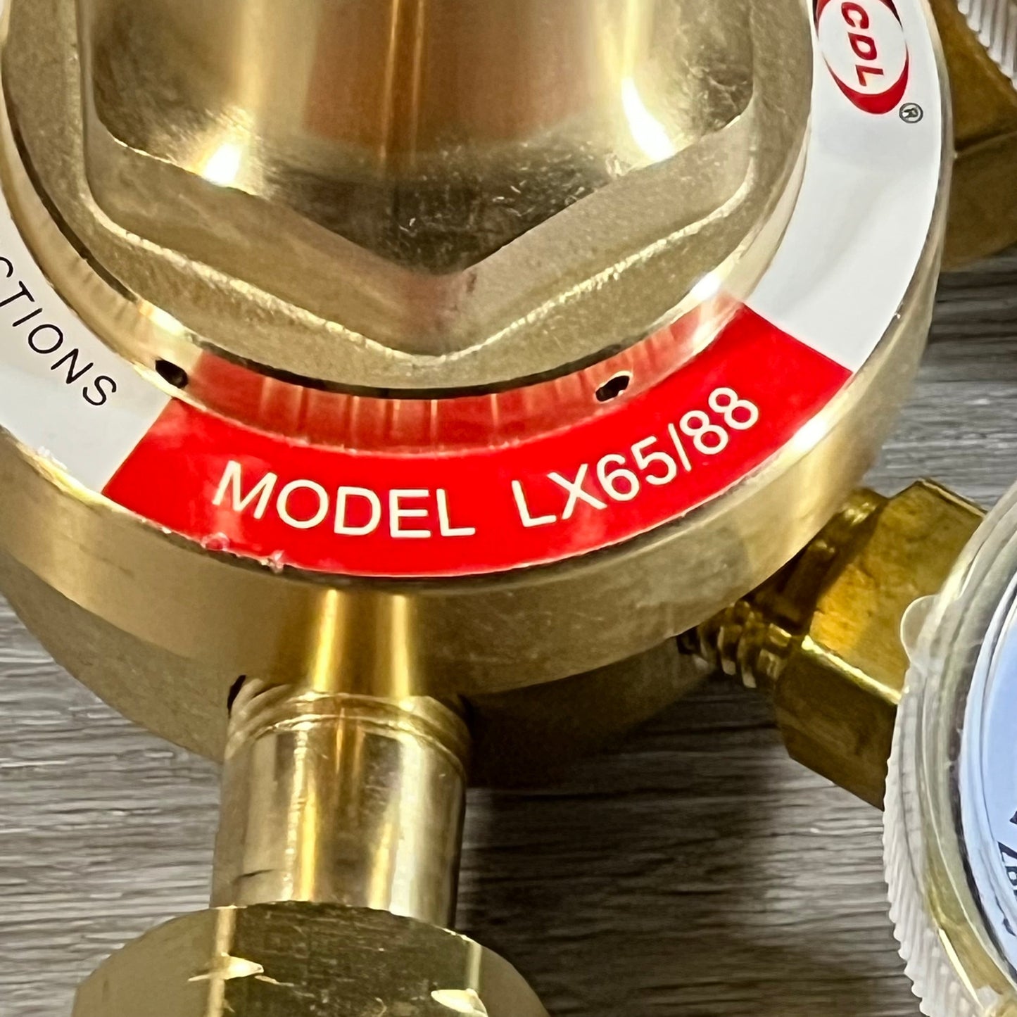 Close-up of LX65/88 Acetylene Regulator, featuring brass construction and CGA510 Connection.