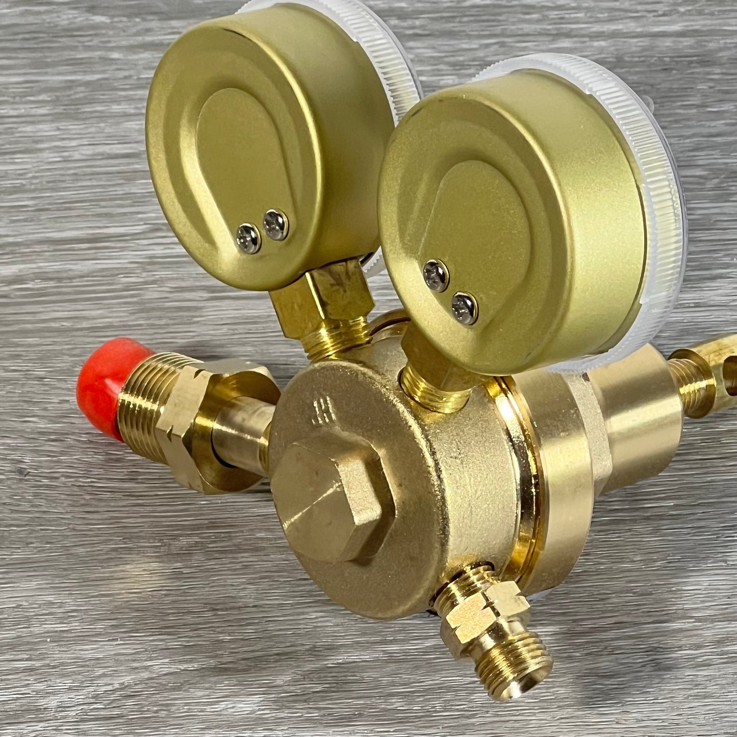 Heavy-duty LX65/88 acetylene regulator with dual gauges and CGA510 connection on a wooden surface.