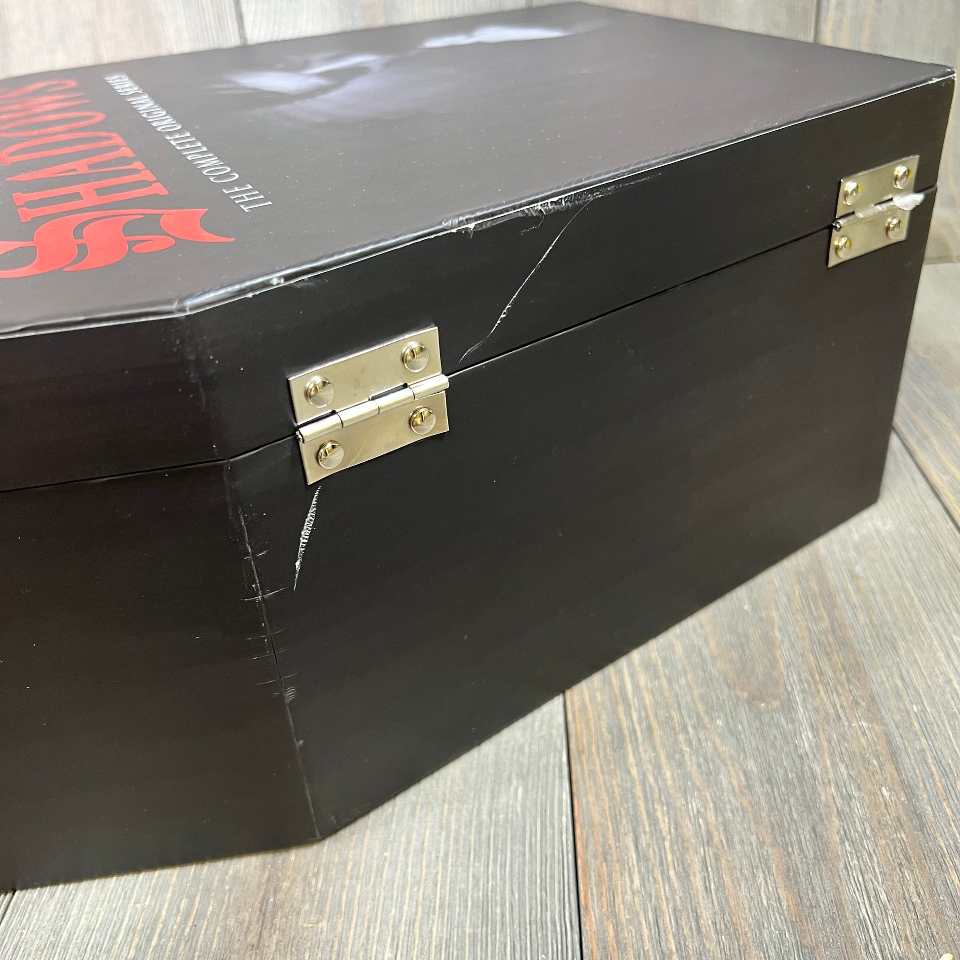 Alt text: Black box set of "Dark Shadows: The Complete Original Series (Deluxe Edition)" with visible hinges and slight scrat