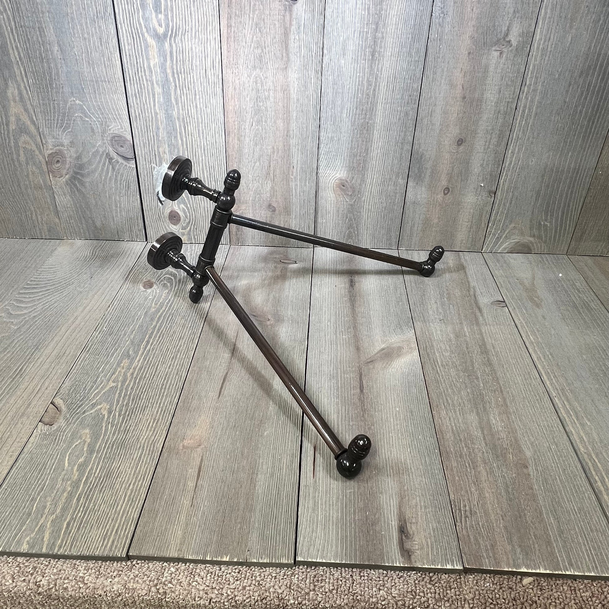 Antique copper swing arm towel rail from the Allied Brass Waverly Place Collection, elegantly displayed on wooden background.