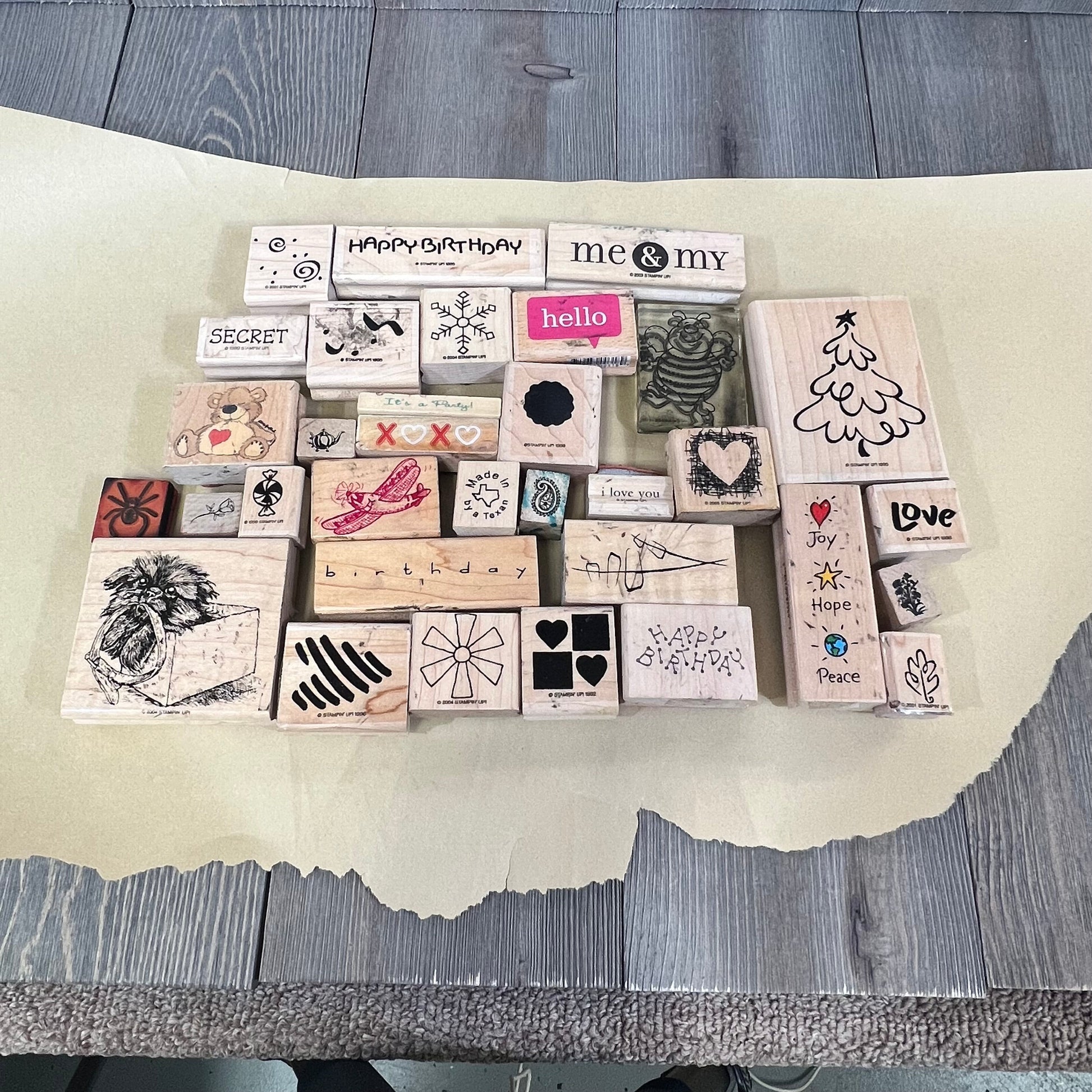 Assorted wooden ink stamps from Bag of Ink 33 collection, featuring diverse designs for crafting and creative projects.