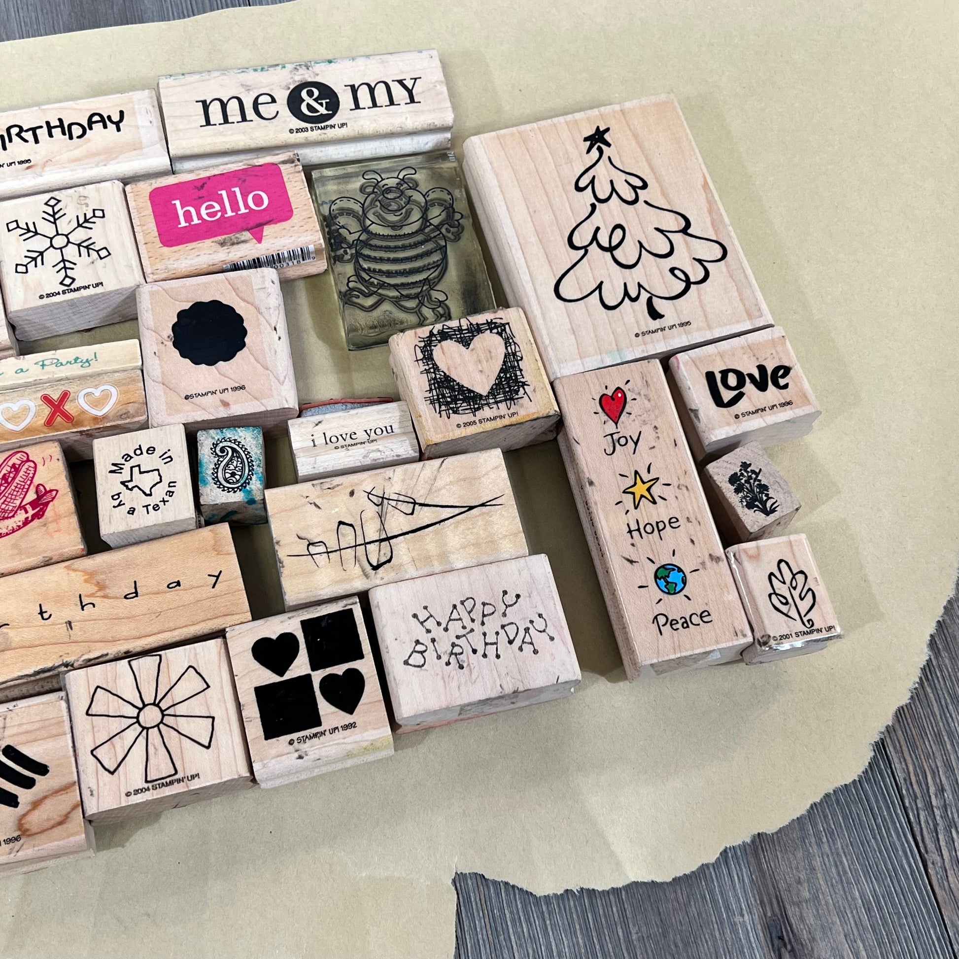 Wooden rubber stamps with diverse designs from the Bag of Ink 33 collection, perfect for crafts and scrapbooking.