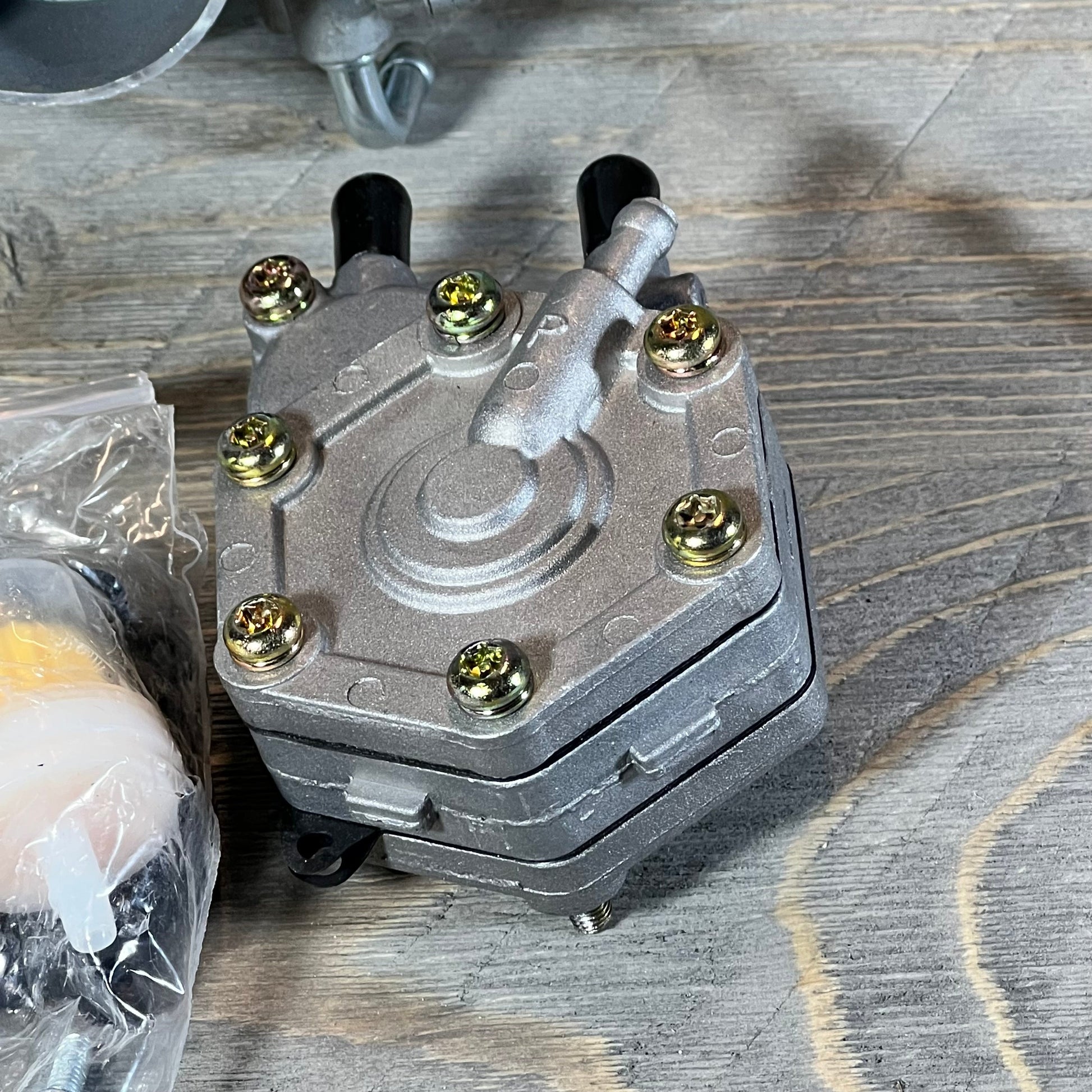 ATV carburetor replacement for Polaris Sportsman 500, showcasing robust metallic construction and detailed fittings.