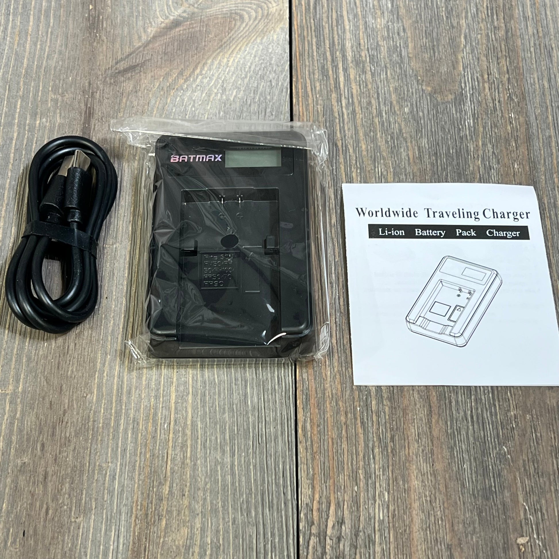 Batmax LCD USB Charger with cable and manual for NP-FH50, compatible with Sony Alpha DSLR and Cyber-Shot cameras.