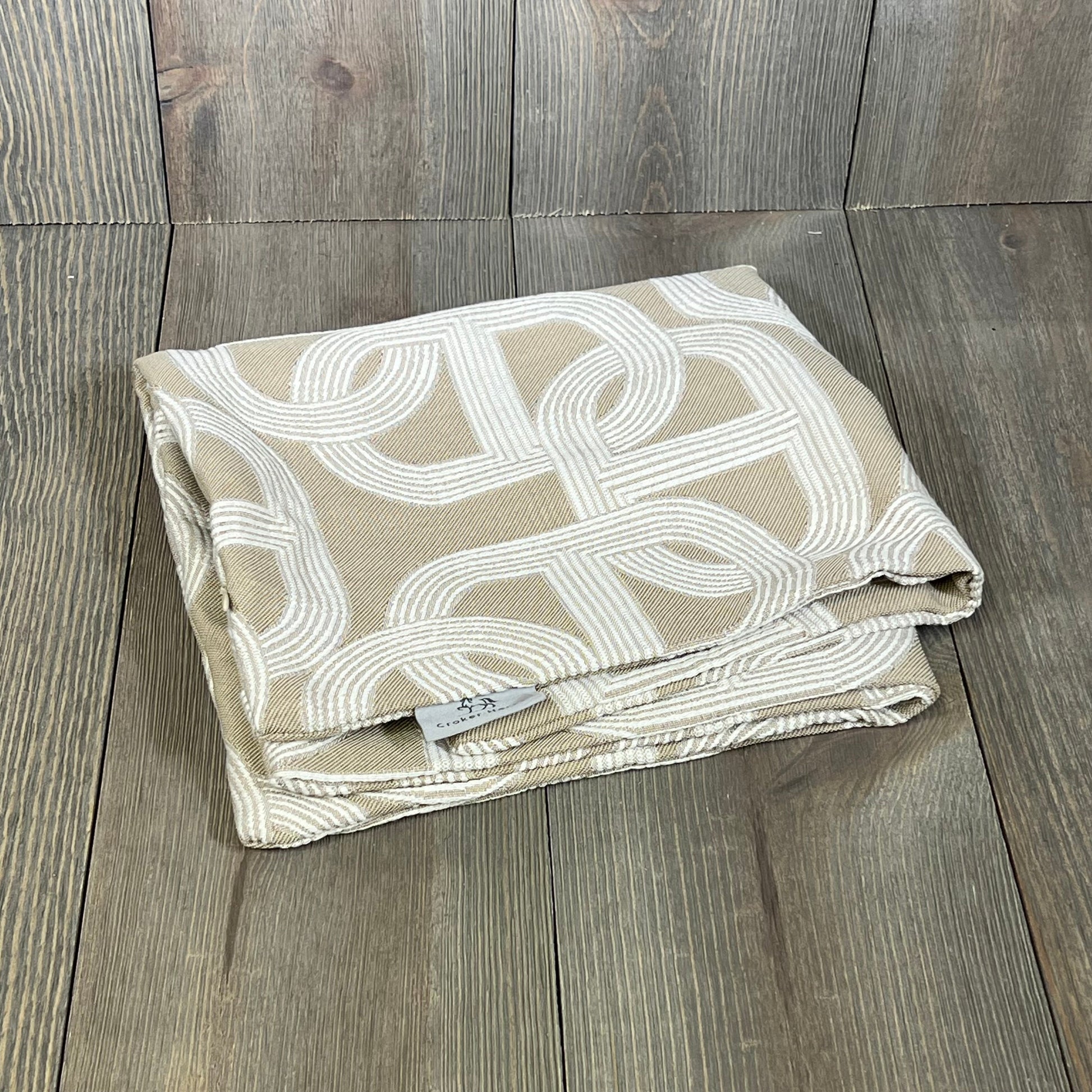 Luxury chenille jacquard pillow cover with pig nose pattern, folded on a wooden surface, 18x18 inches.