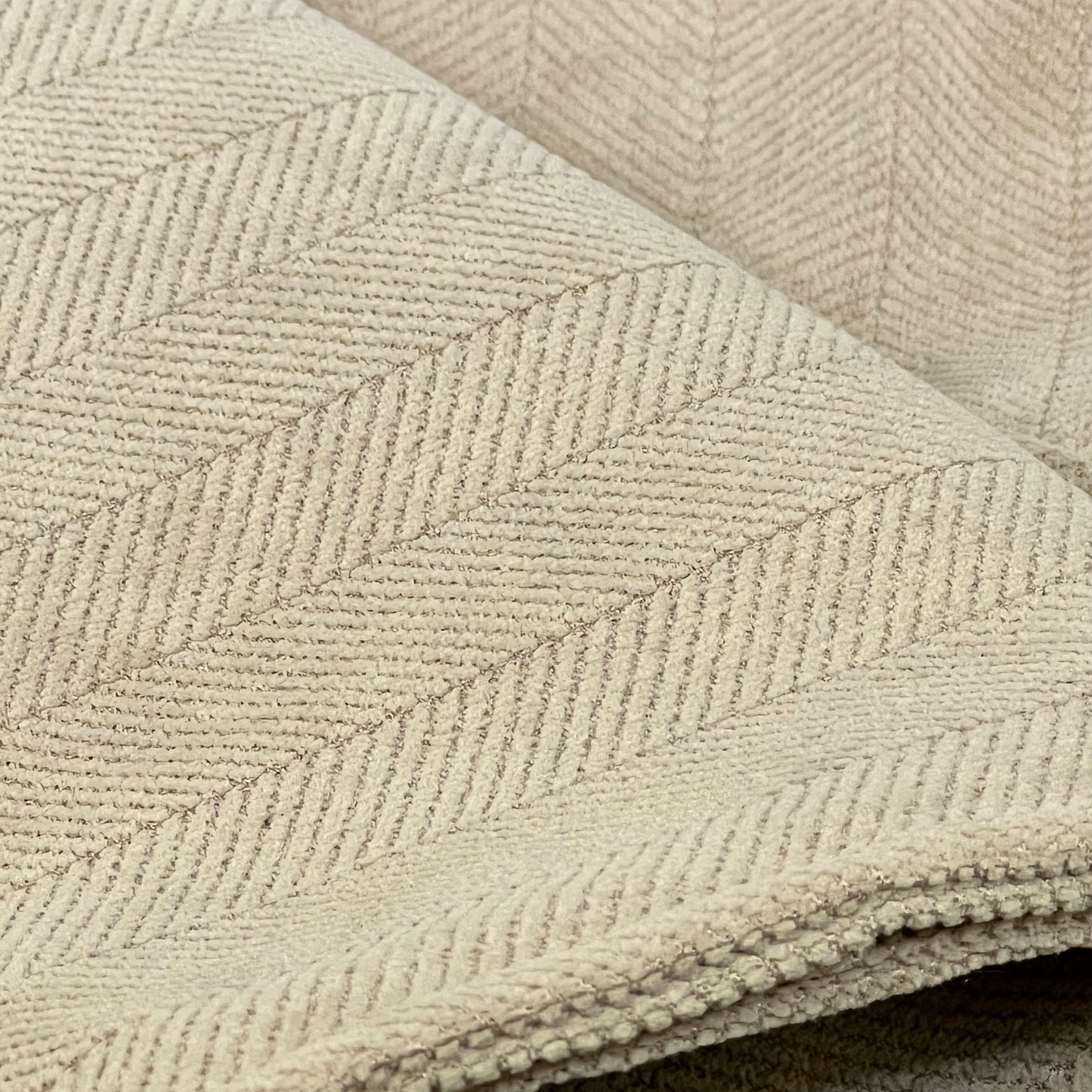 Khaki chenille pillow covers with herringbone pattern, 22x22 inches, soft and luxurious for elegant home decor.
