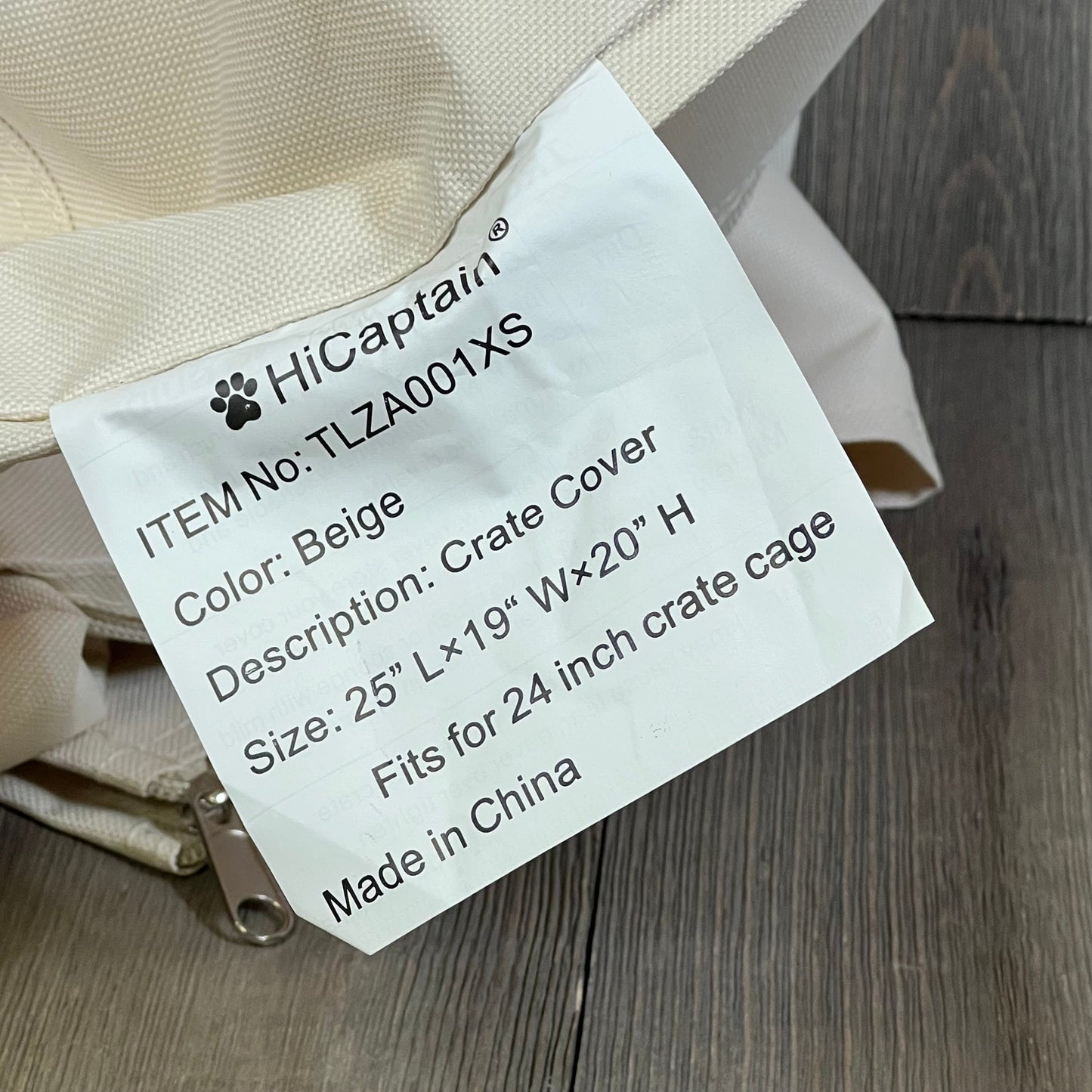 Light tan HiCaptain dog crate cover label detail, showcasing size and specifications for 24-inch wire crate protection.
