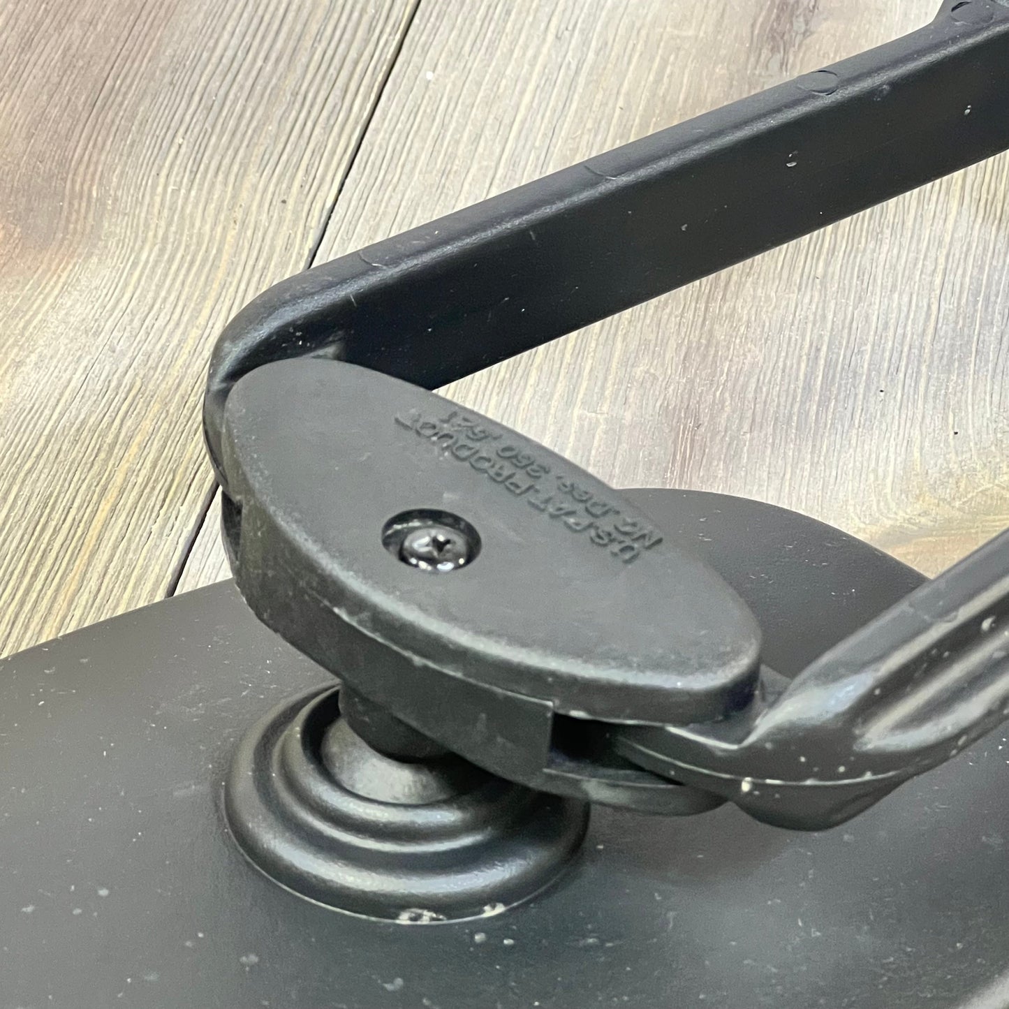 Universal clip-on mechanism of MirroGuard towing mirrors, showcasing durable black finish for pickups, RVs, and trailers.