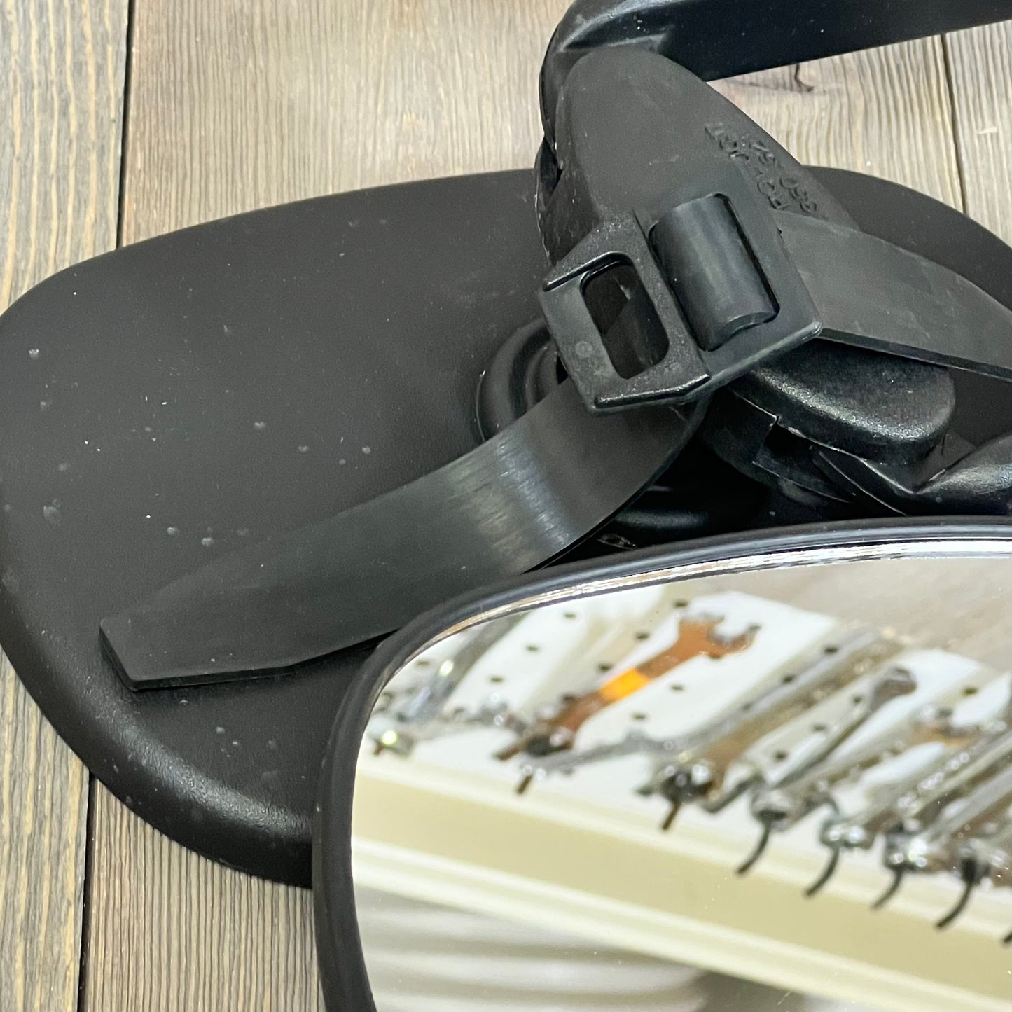 Universal clip-on towing mirror with extender straps for pickups, RVs, and trailers, showcasing durable black design.