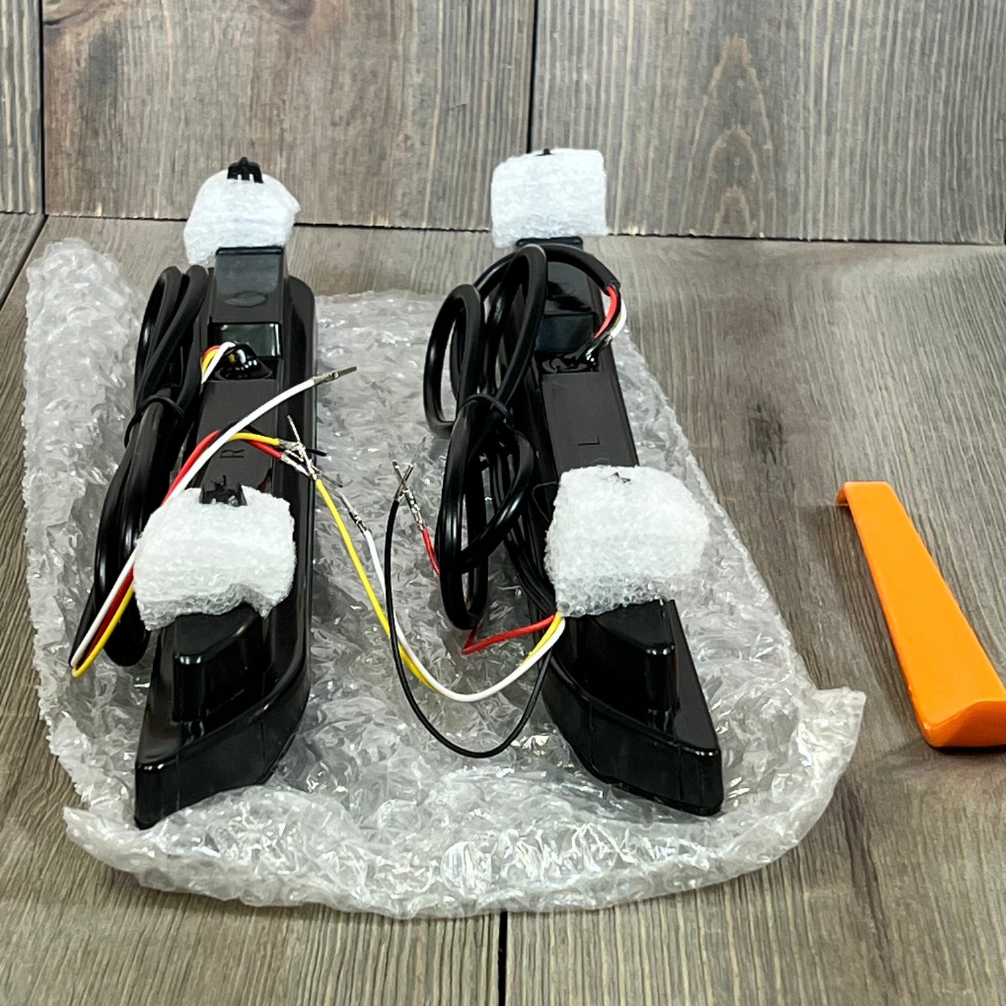Red Lens LED Rear Reflector Bumper Fog Light Assembly for Ford Explorer, shown with installation tools and wiring.
