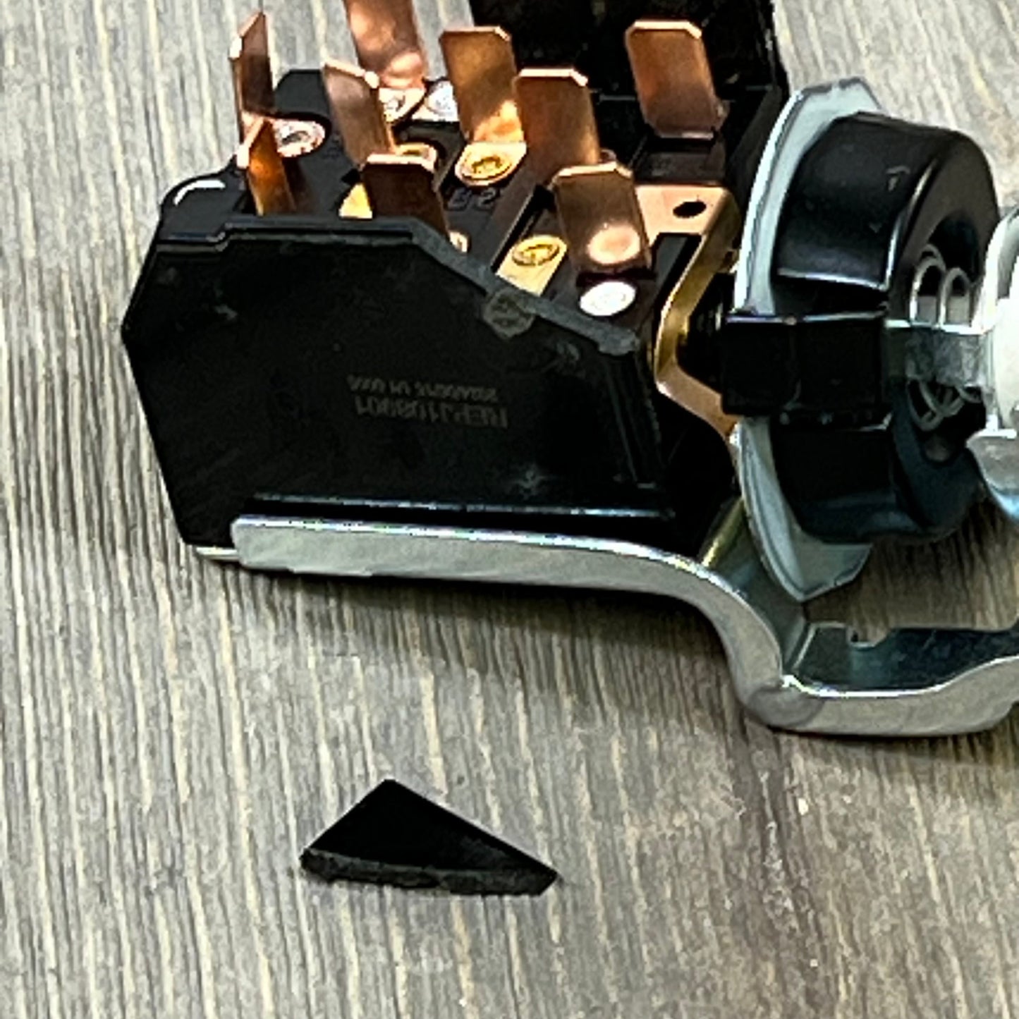 Close-up of Dodge Ram 1500/2500/3500 headlight switch, showing intricate copper connectors and durable black housing.