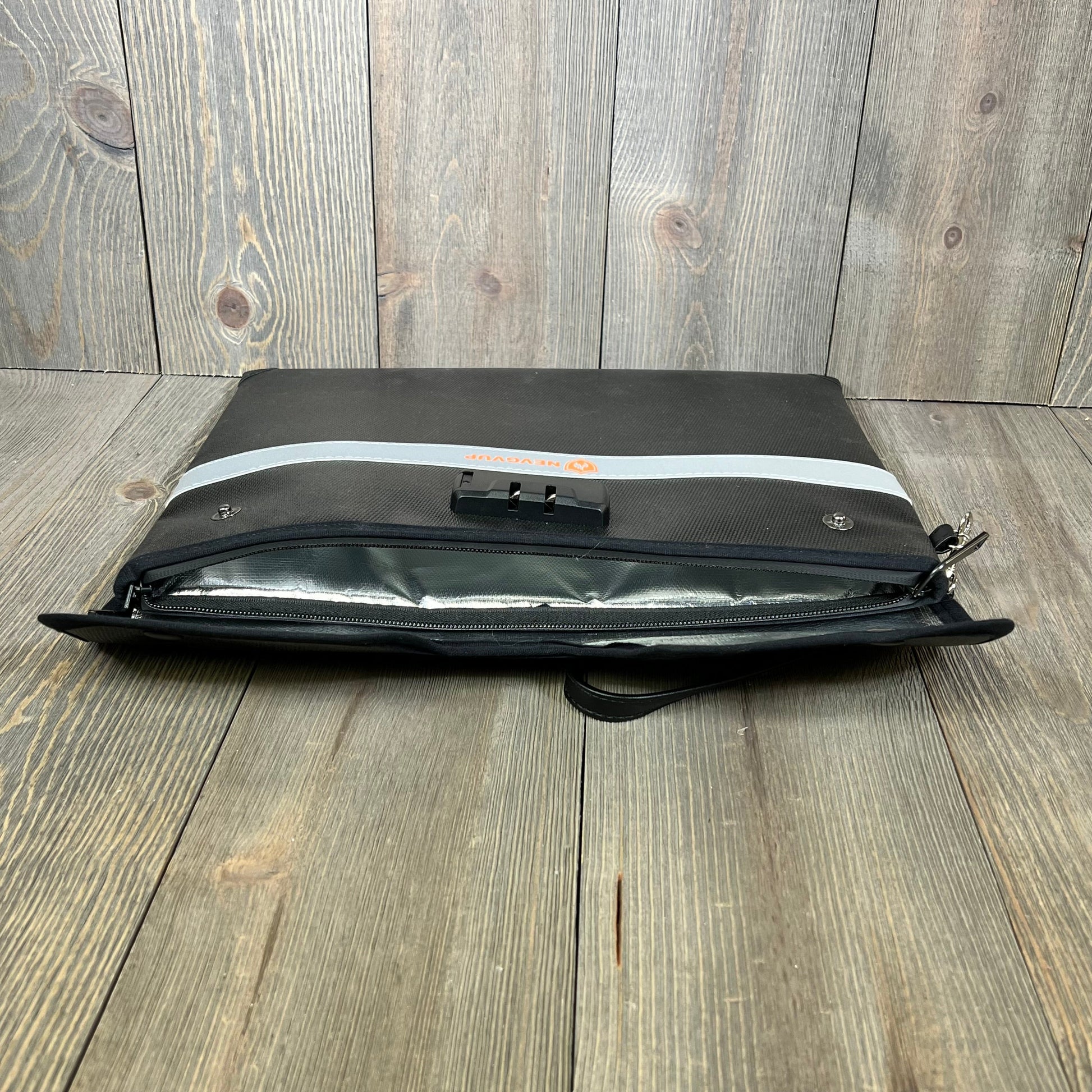 Fireproof document bag with lock, showing open zipper and reflective strip, ideal for secure document protection.