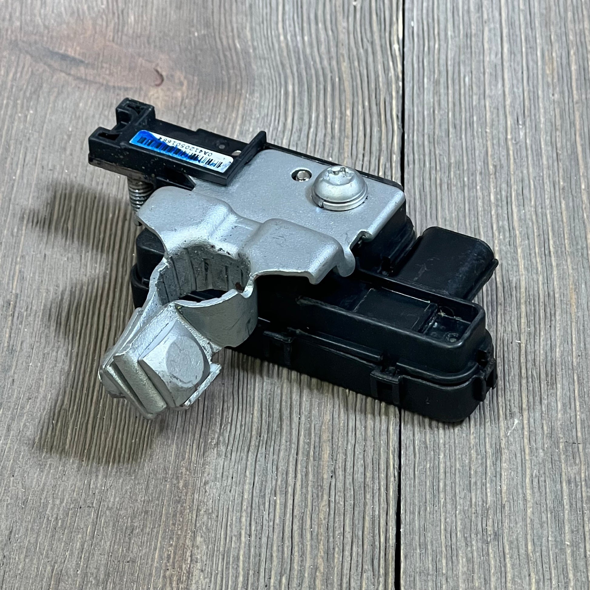 Battery sensor for Honda Accord 2013-2017, Acura RLX 2014-2017 on wooden surface, compatible with OEM parts.