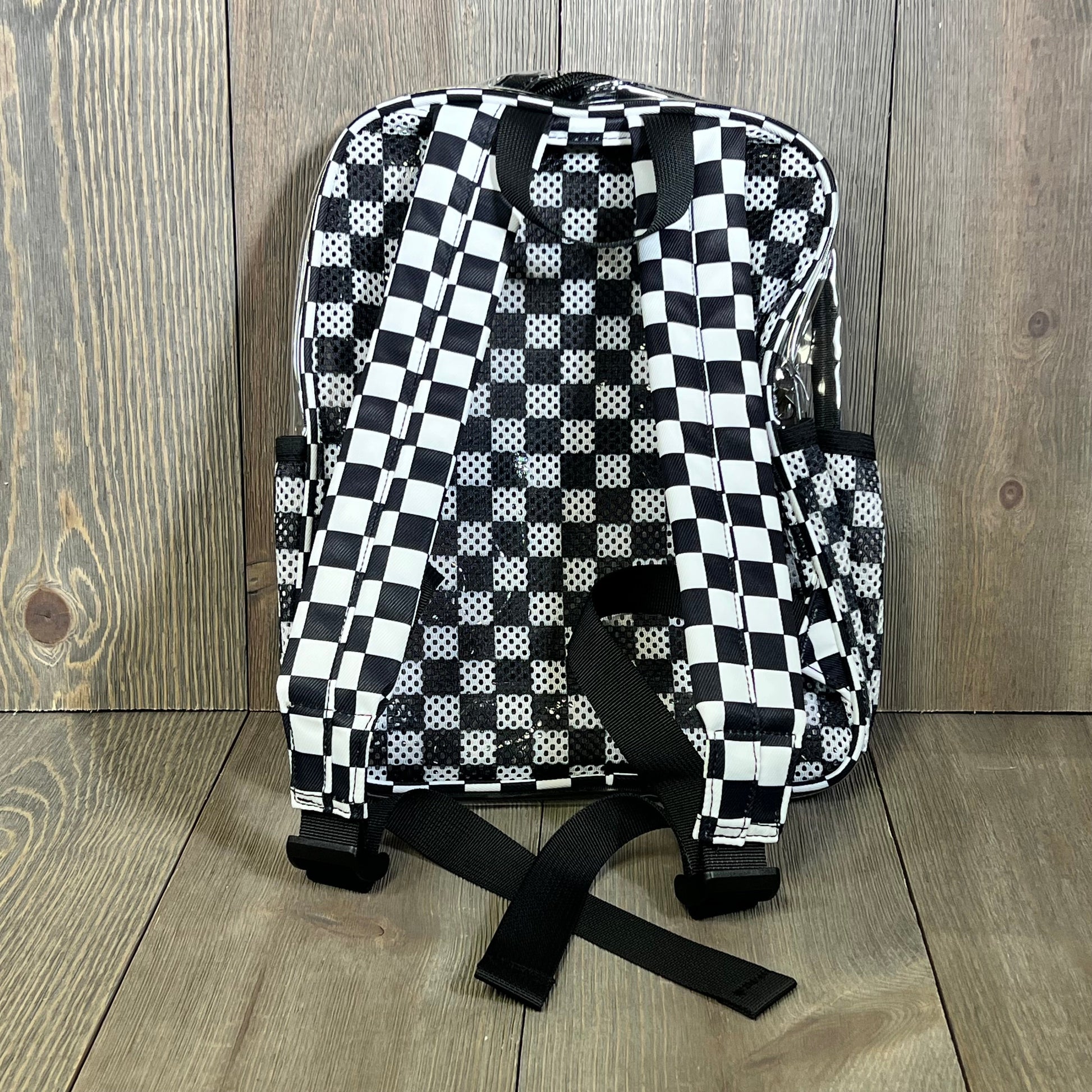 Clear mini backpack with checkered strap design, ideal for stadium events, concerts, and secure travel.