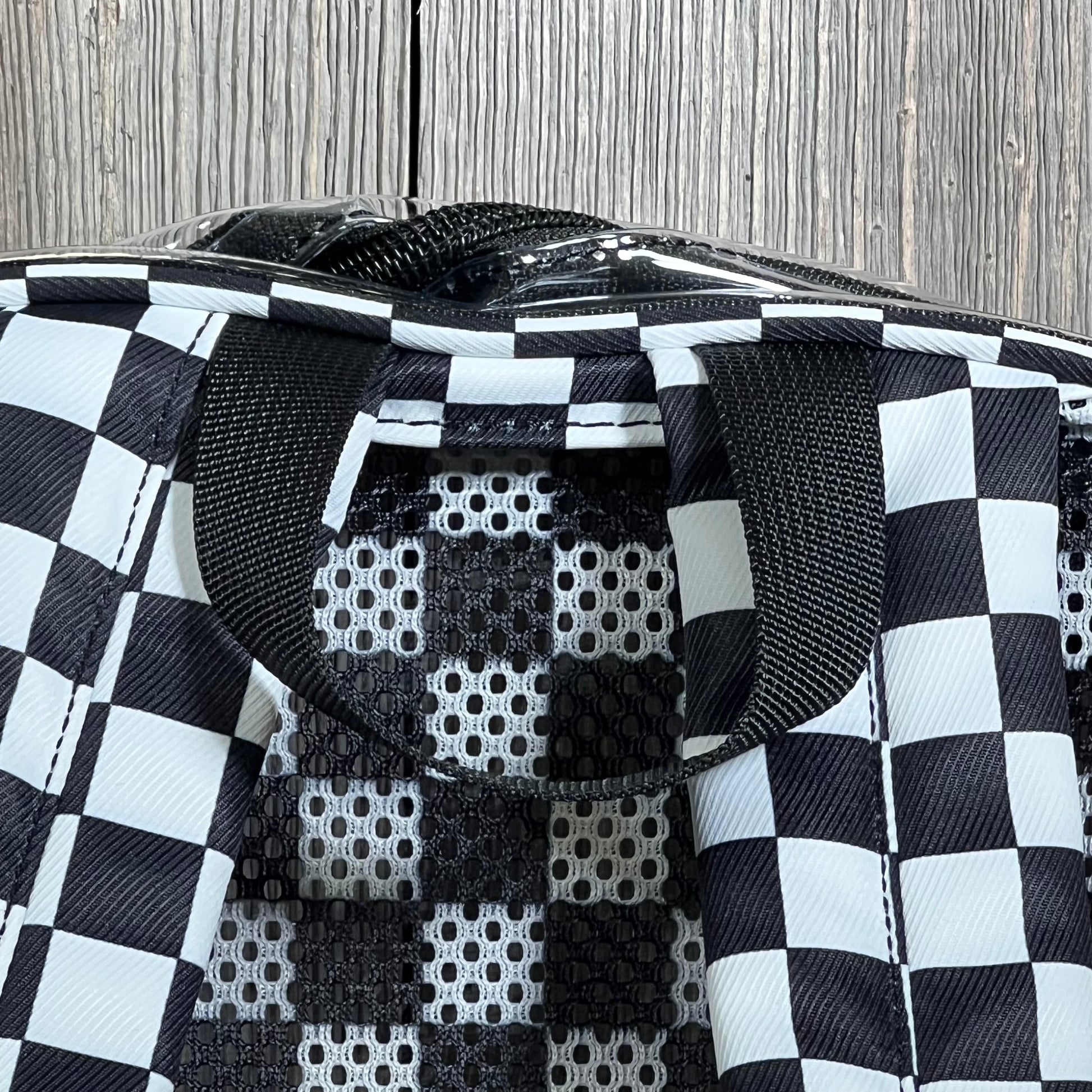Checkered pattern detail on clear mini backpack, ideal for stadium events and concerts with security-friendly design.