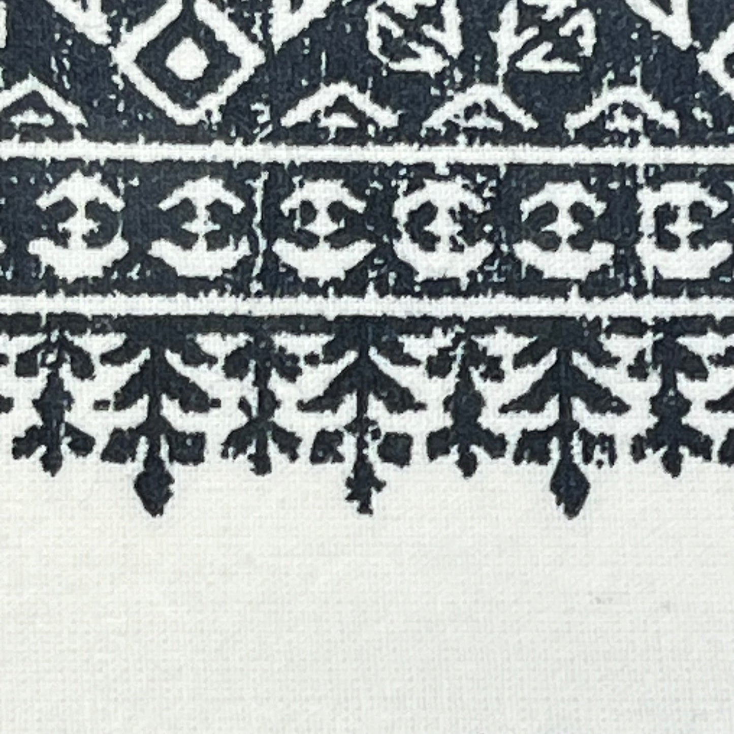 Boho design detail on navy and white tufted chenille curtain, showcasing intricate pattern for stylish window treatment.
