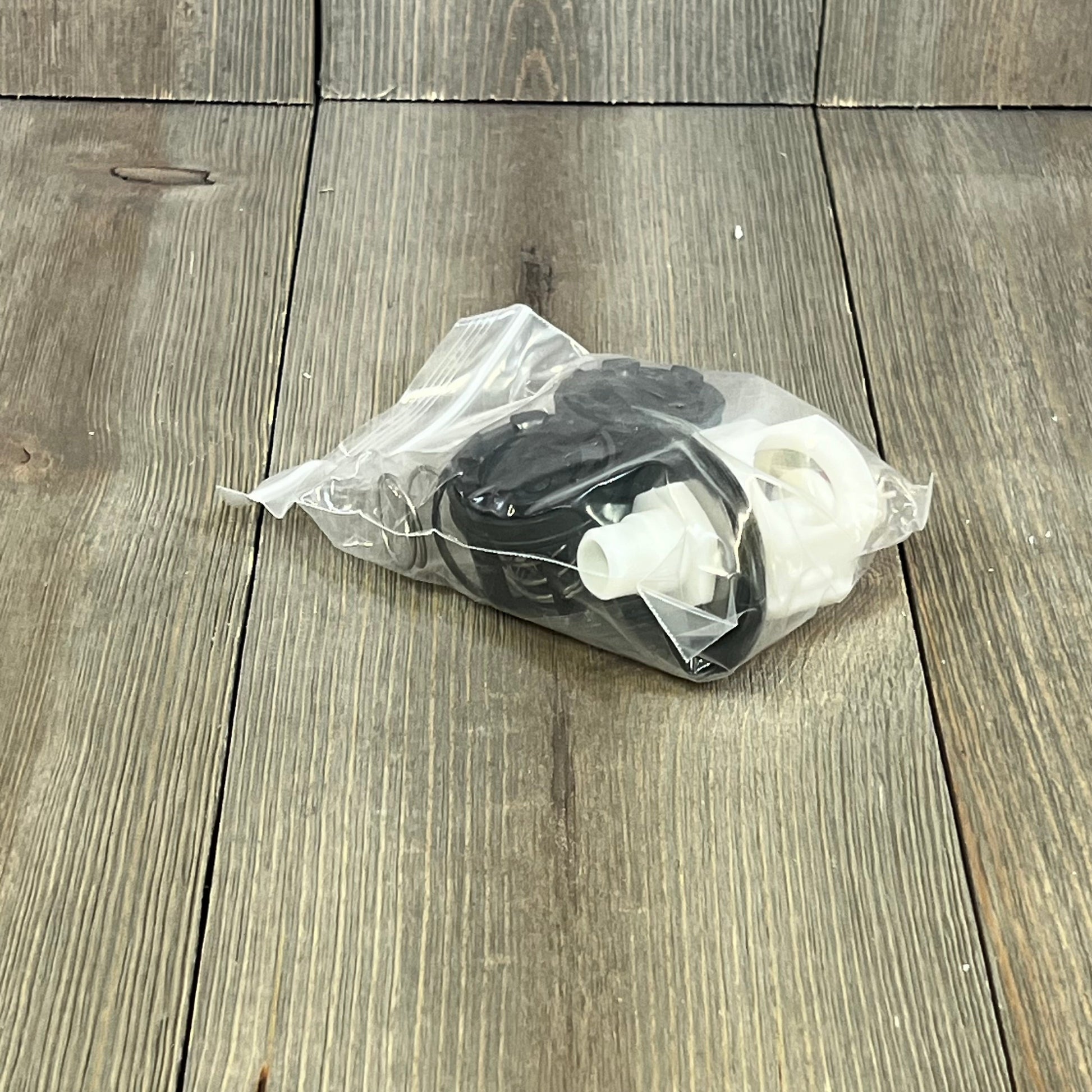 Repair kit components in clear packaging for 3/4" reduced pressure zone assembly, including relief and check valve parts.