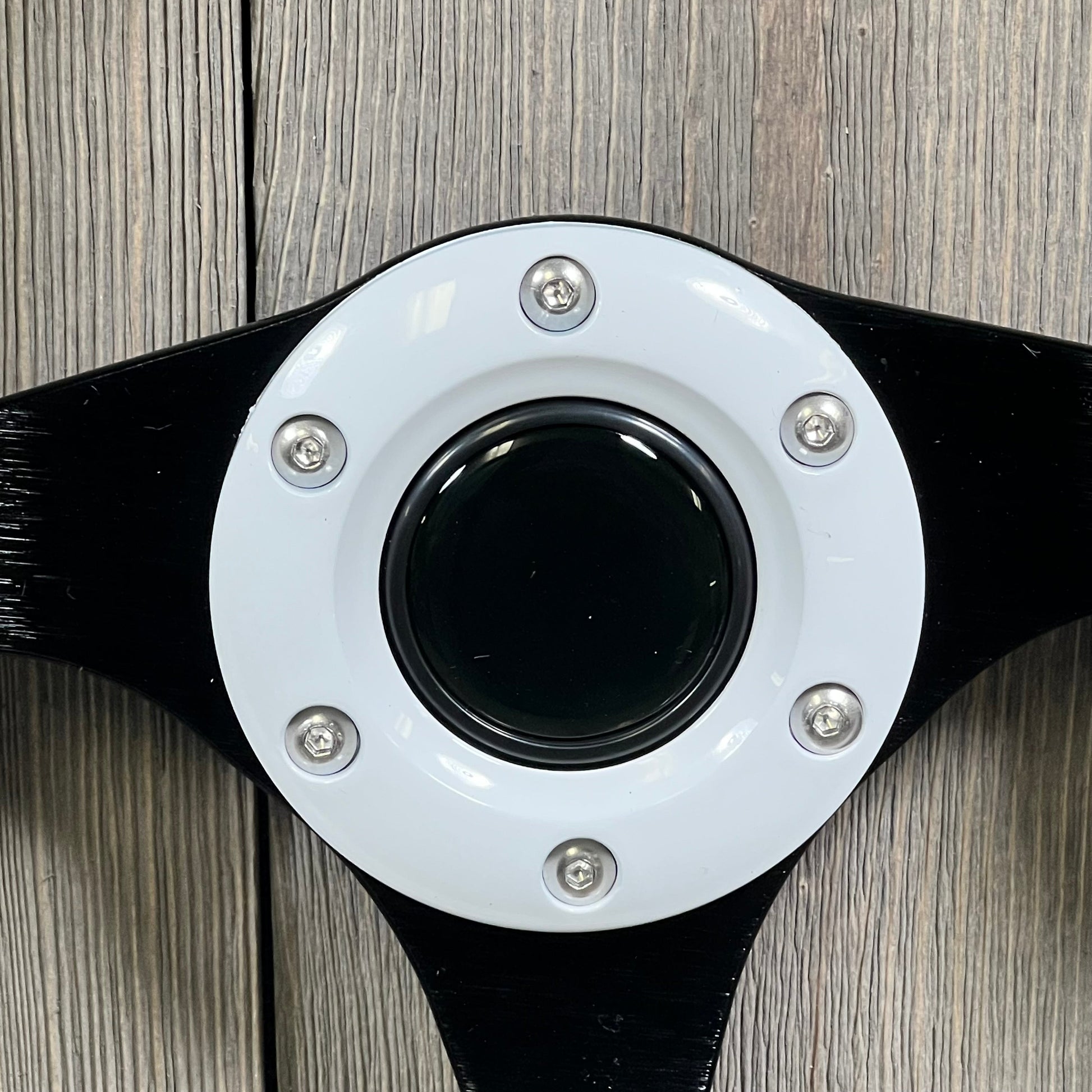 Close-up of QYMOPAY 12.5 Inch boat steering wheel hub with black and white finish, featuring durable marine-grade design.