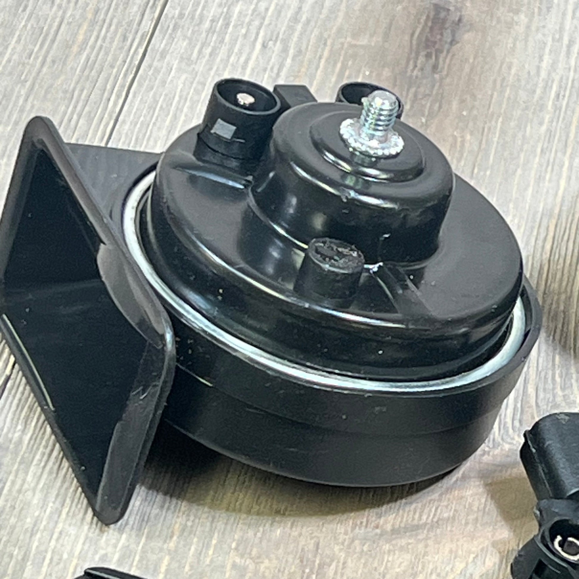 Loud dual-tone car horn for Honda Civic, CRV, and more, featuring a sleek black design for enhanced vehicle safety.