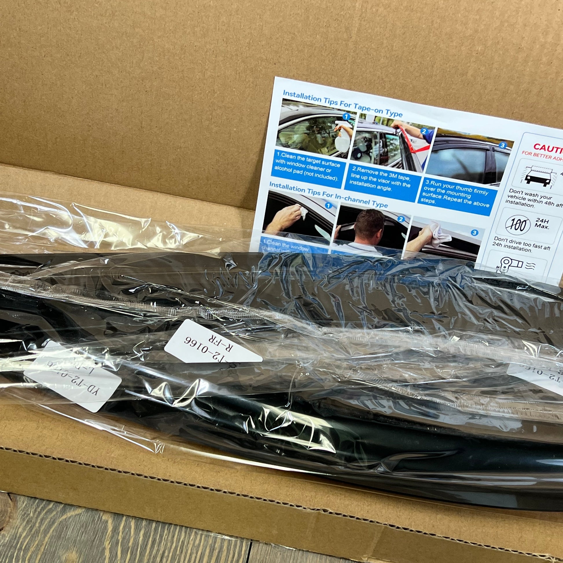 Window visors rain guards in packaging with installation guide for 2015-2024 Ford F150 SuperCab and Raptor models.