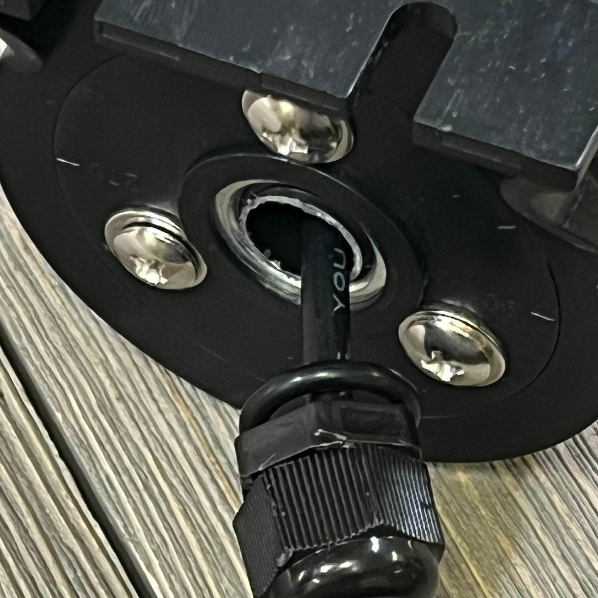 Explosion-proof LED machine light connection detail, showcasing durable black wiring and secure silver fasteners for CNC use.
