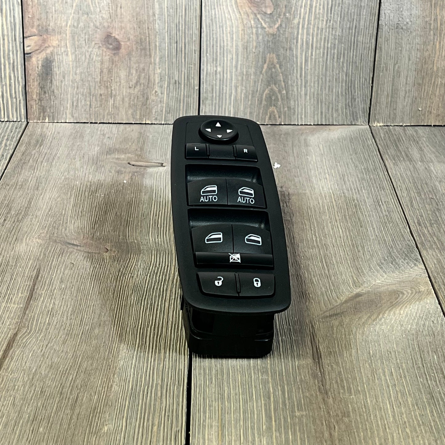 Master power window switch for Chrysler, Dodge, Ram models, featuring dual auto controls and lock functions.