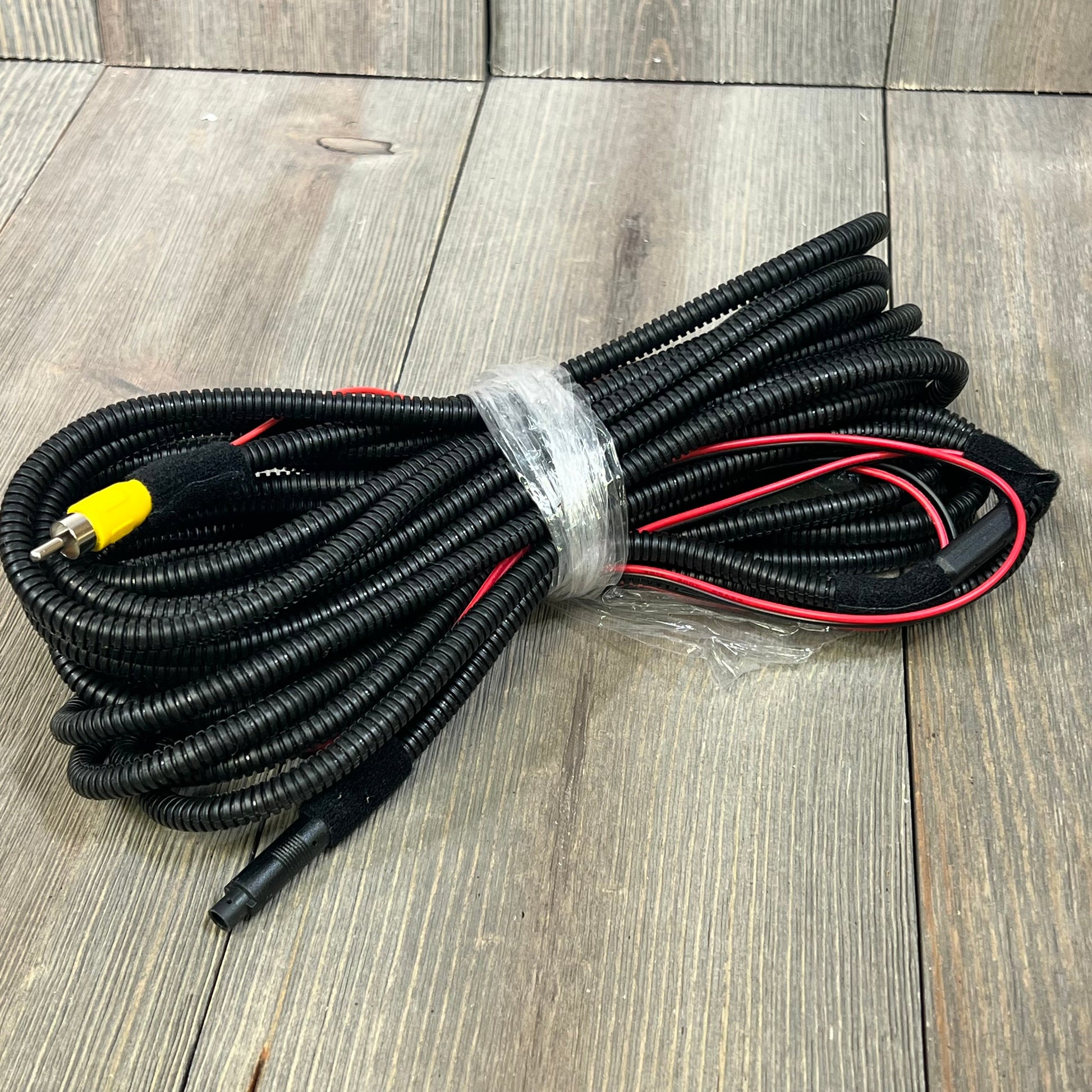 Coiled wiring harness for backup camera tailgate handle, compatible with Ford F-150, F-250, Explorer, and Lobo models.