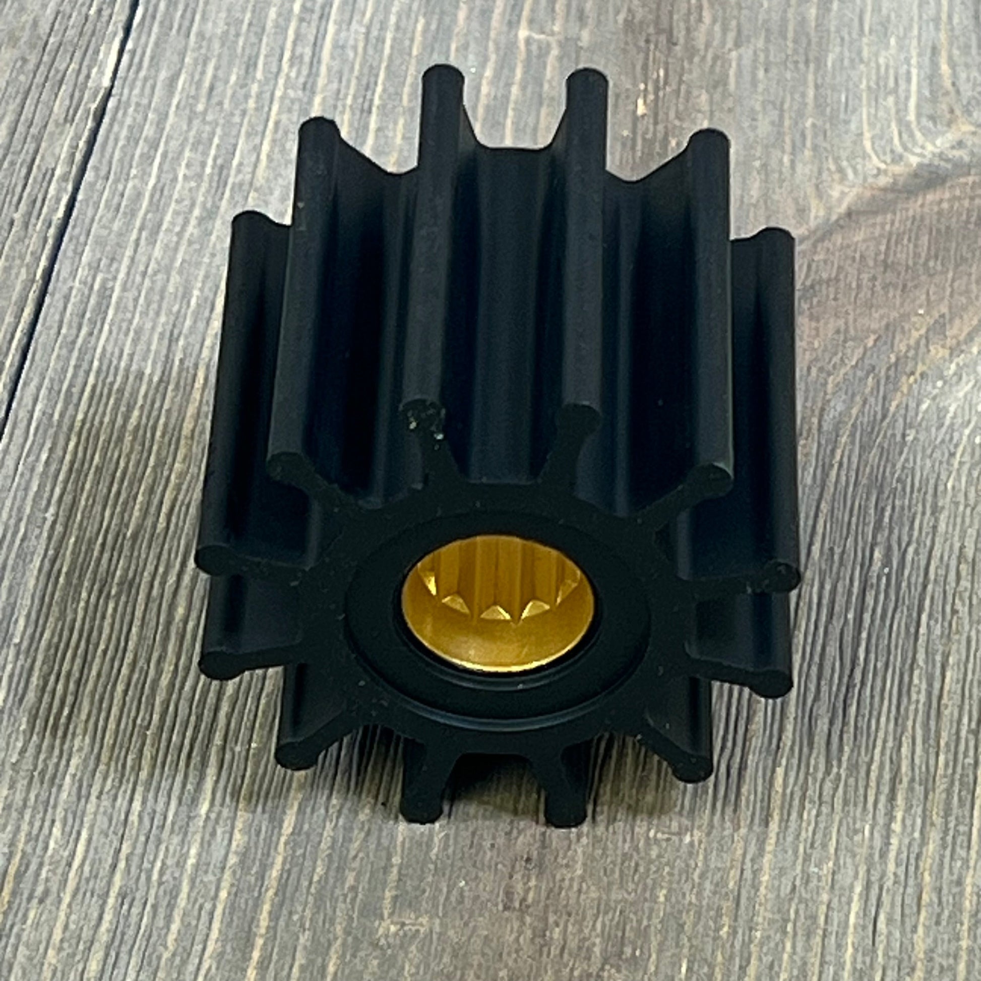 Black water pump impeller with brass center, compatible with Johnson, Yanmar, Sierra, Indmar models.