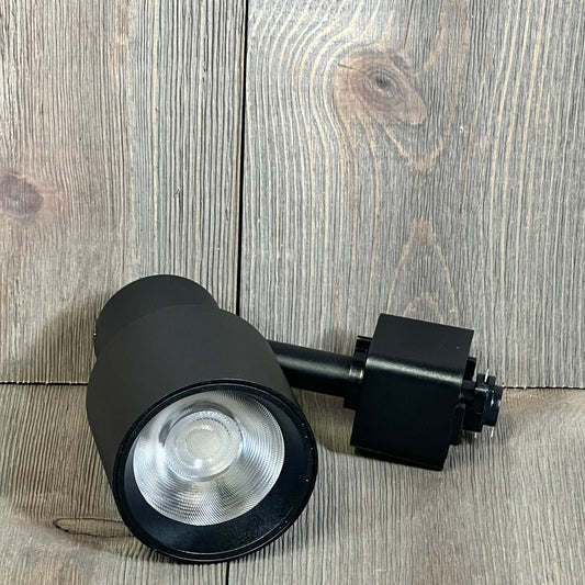 Dimmable black LED track lighting head with 3000K warm light, perfect for accent and task applications.