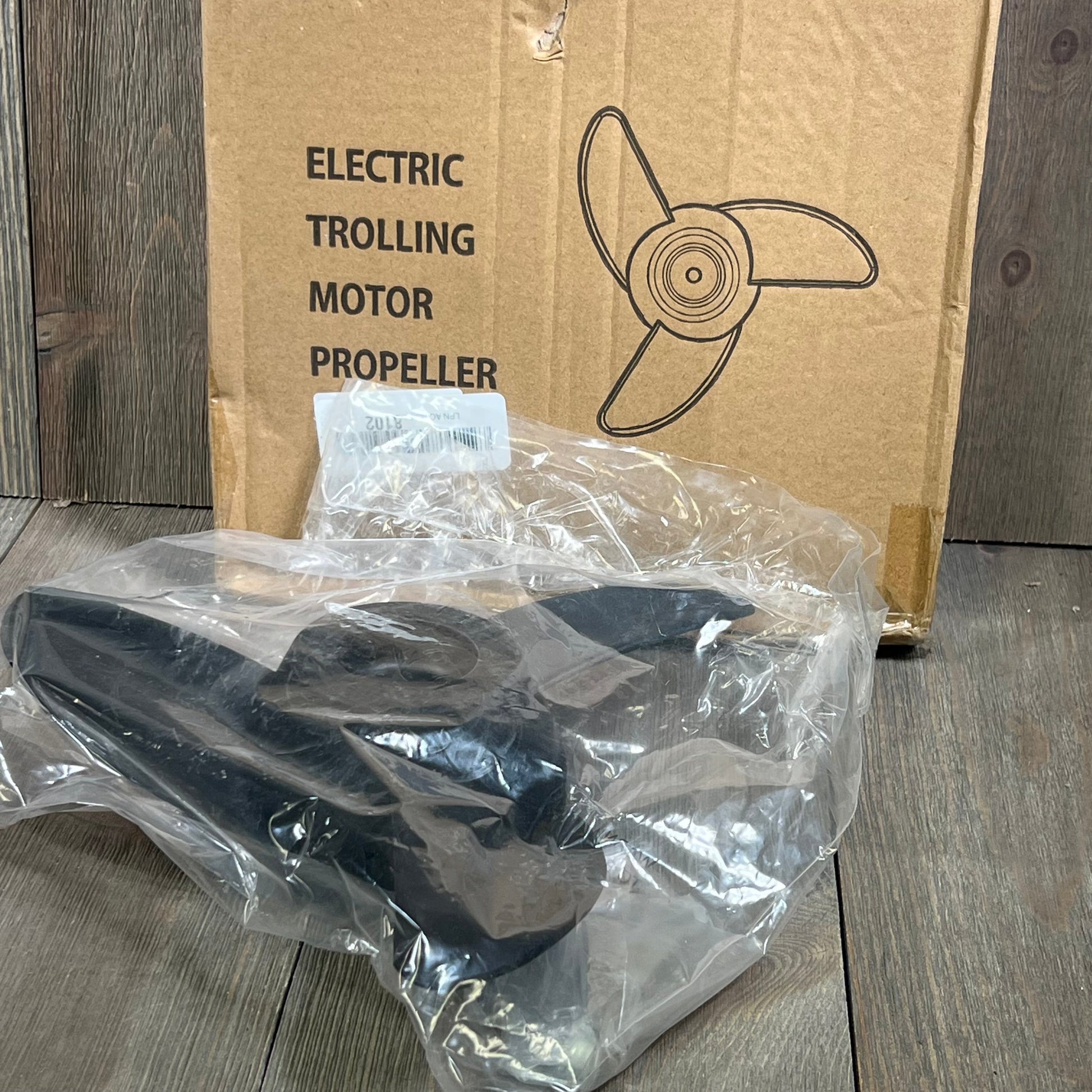 Black 3-blade electric trolling motor propeller in packaging, ideal for 55lb, 62lb, 86lb outboard motors, with box.