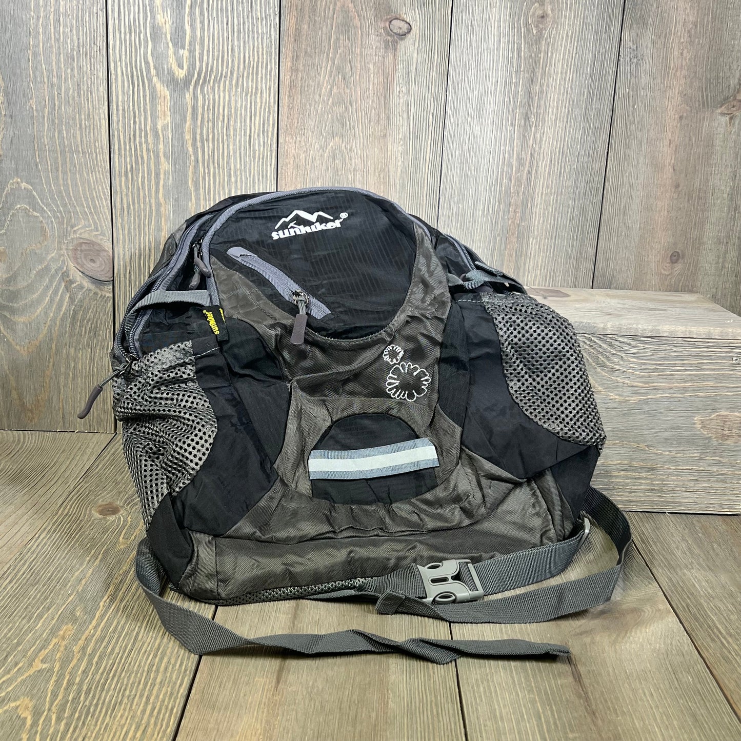 Lightweight Sunhiker cycling backpack in black and grey, designed for outdoor hiking with water-resistant material.