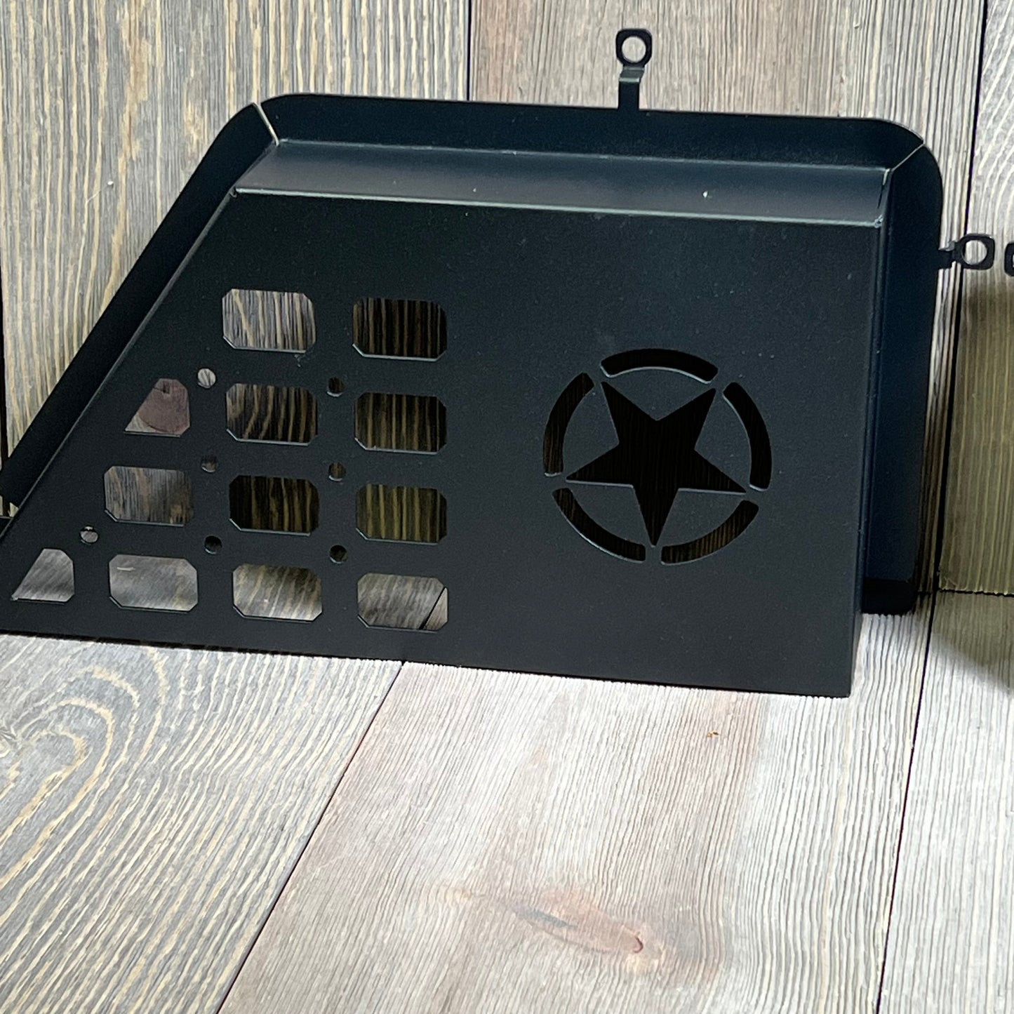 Black metal storage pocket with star cutout, designed for 2011-2018 Jeep Wrangler JK JKU front door organization.