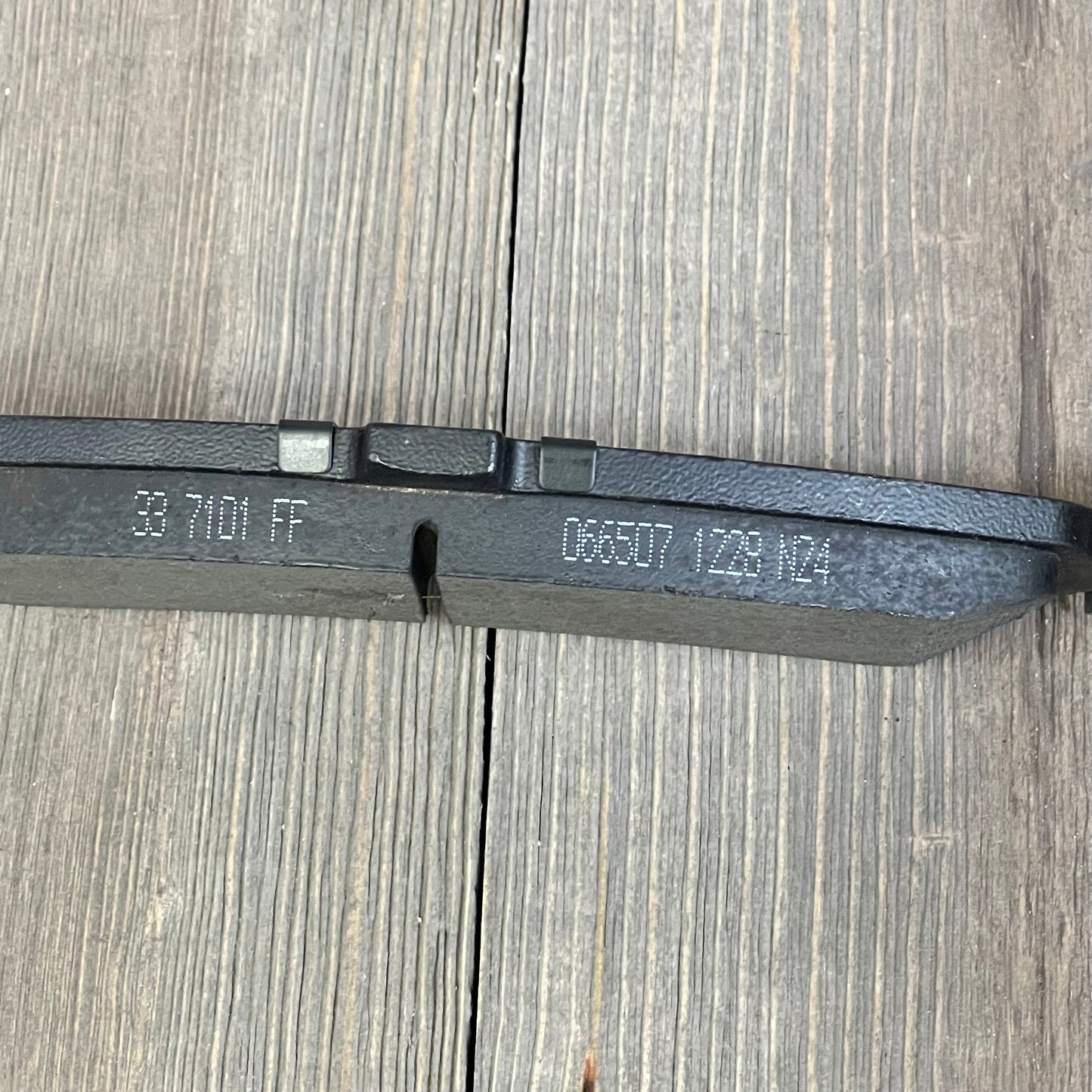 Rear view of ECCPP ceramic brake pad with engraved details, compatible with Cadillac, Chevrolet, GMC models.