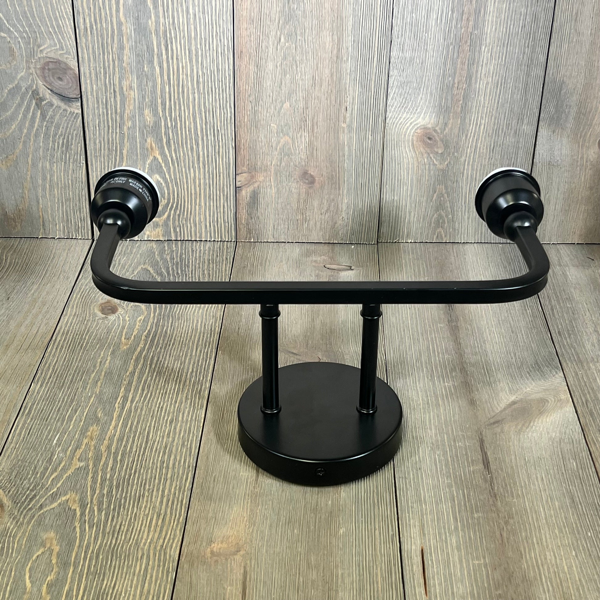 Modern matte black bathroom vanity light with sleek design, ideal for contemporary interiors.