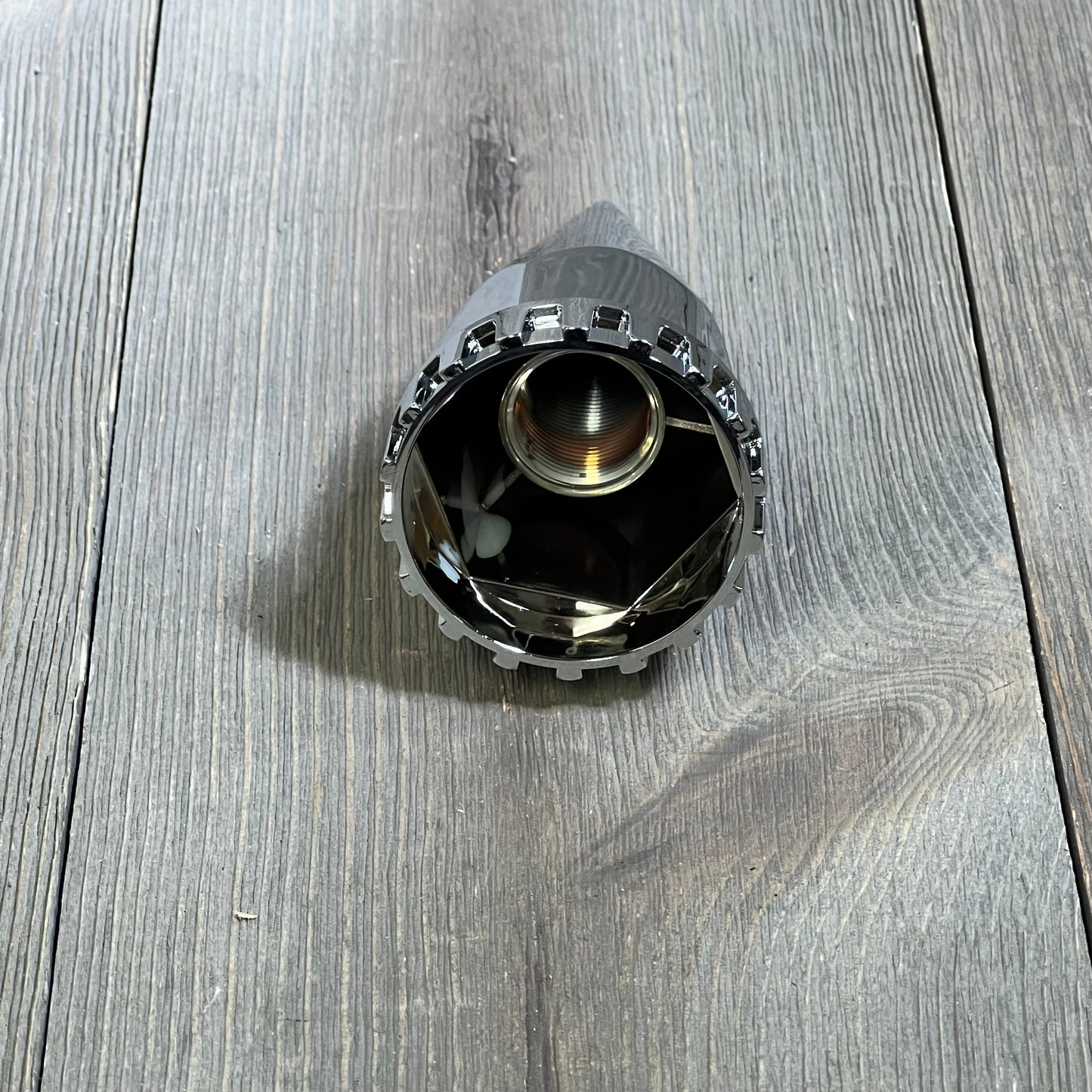Chrome Dazakoot spike lug nut cover, 33mm x 4 3/4", showcasing detailed threading and pointed design for semi trucks.