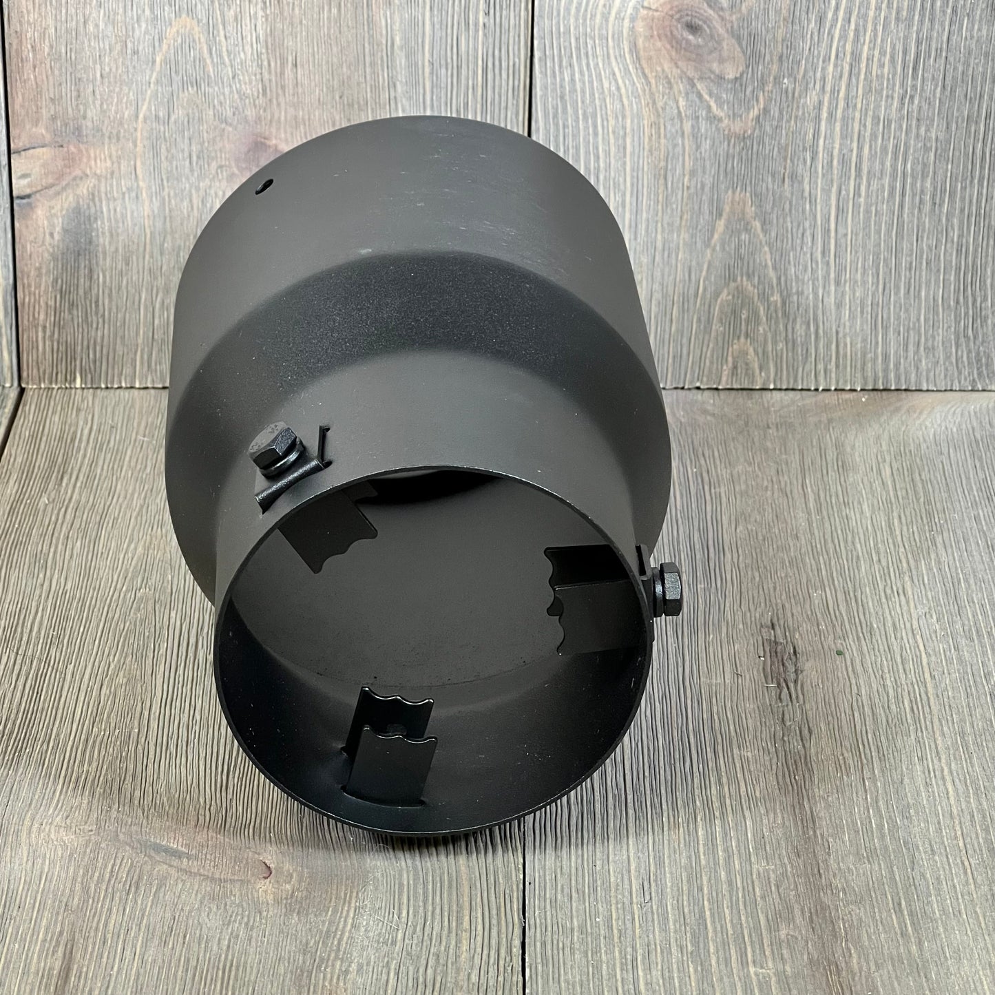 Black powder-coated TriTrust exhaust tip, adjustable 2.5-3 inch inlet, 4.5'' outlet, durable stainless steel construction.