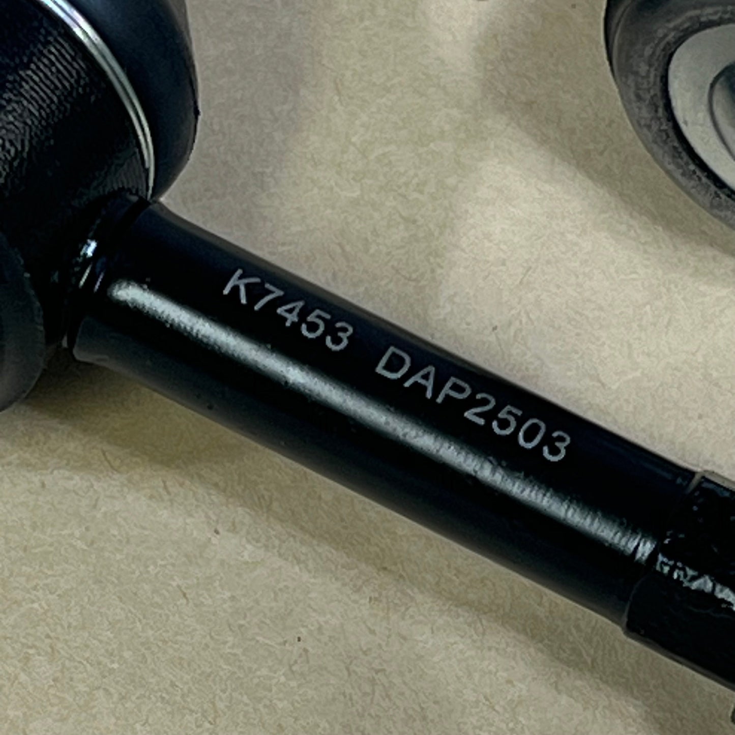 Close-up view of DEARMMGG sway bar link for Dodge Ram 4WD, featuring K7453 marking for 2000-2002 models.