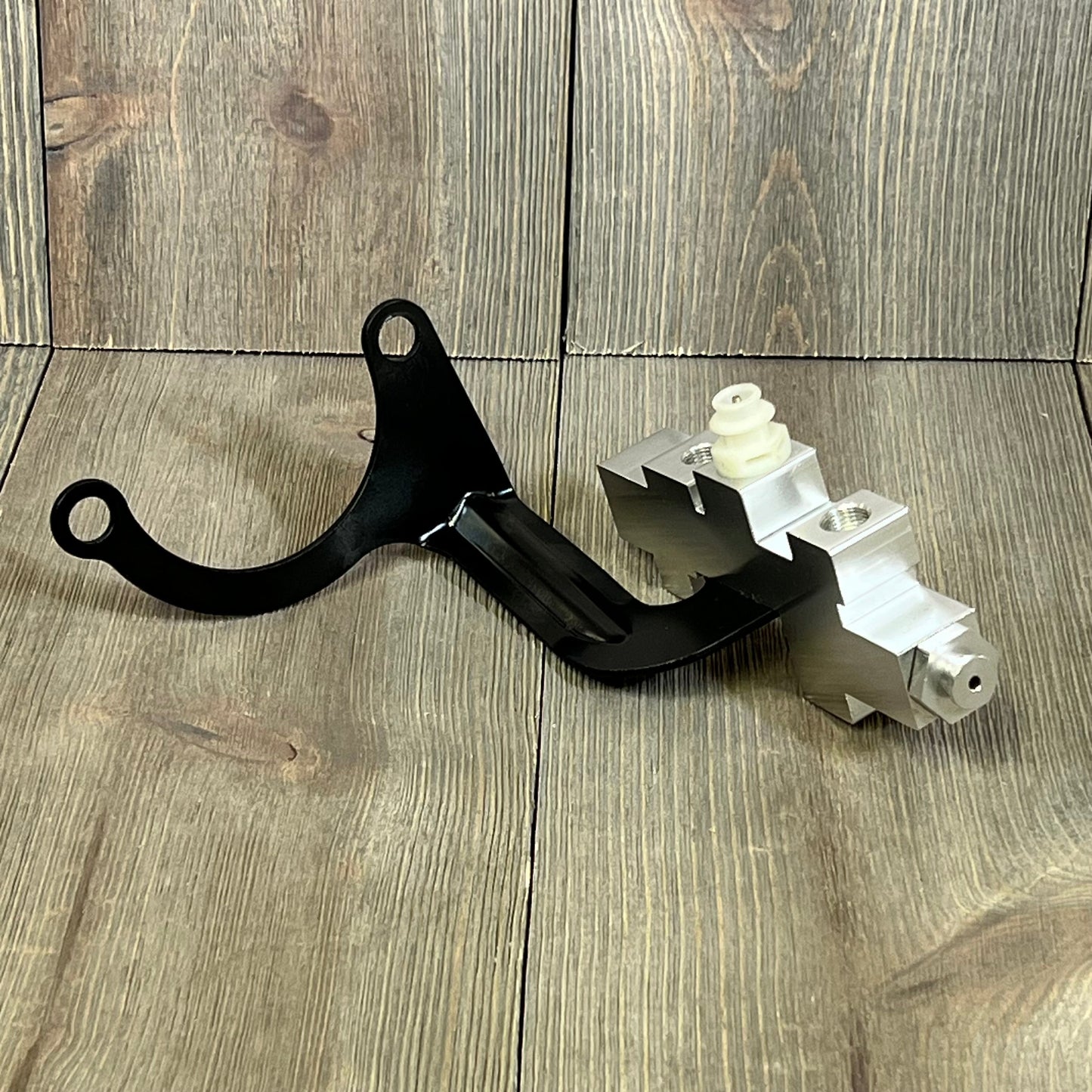 Brake proportioning valve replacement for GM Chevy Truck C/K 1500 2500 3500, 1989-1994, on wooden background.
