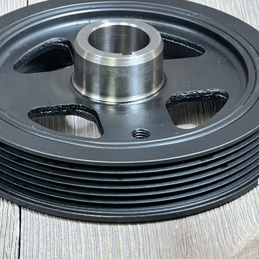 Close-up of AULINK 594-404 harmonic balancer crankshaft pulley for Lexus, Scion, Toyota, showing grooves and hub.