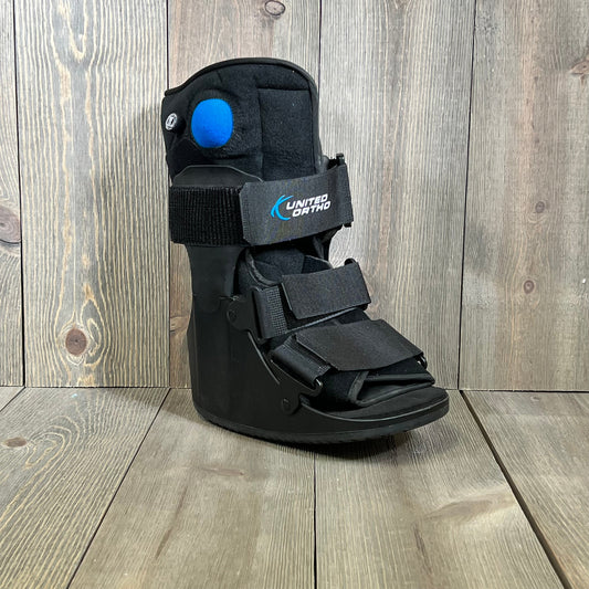 United Ortho short air cam walker fracture boot in black, extra small size, featuring adjustable straps for secure fit.