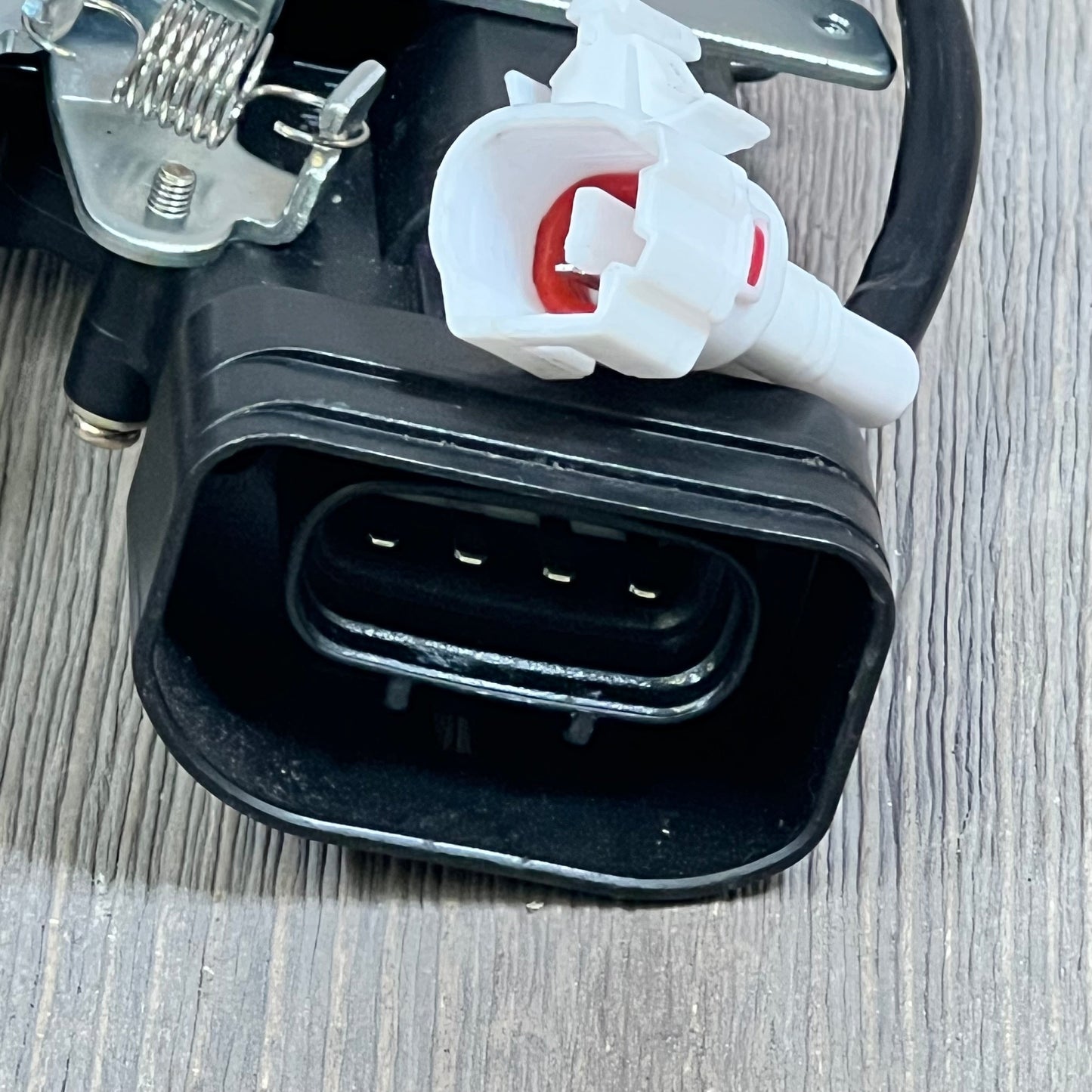 Close-up of the Predep rear trunk latch tailgate lock actuator connector for Toyota Sequoia 2001-2007.
