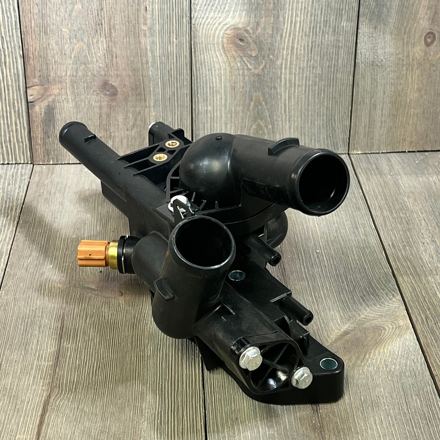 Engine coolant thermostat housing replacement for Kia Forte 2010-2013, compatible with 2.0L and 2.4L engines.
