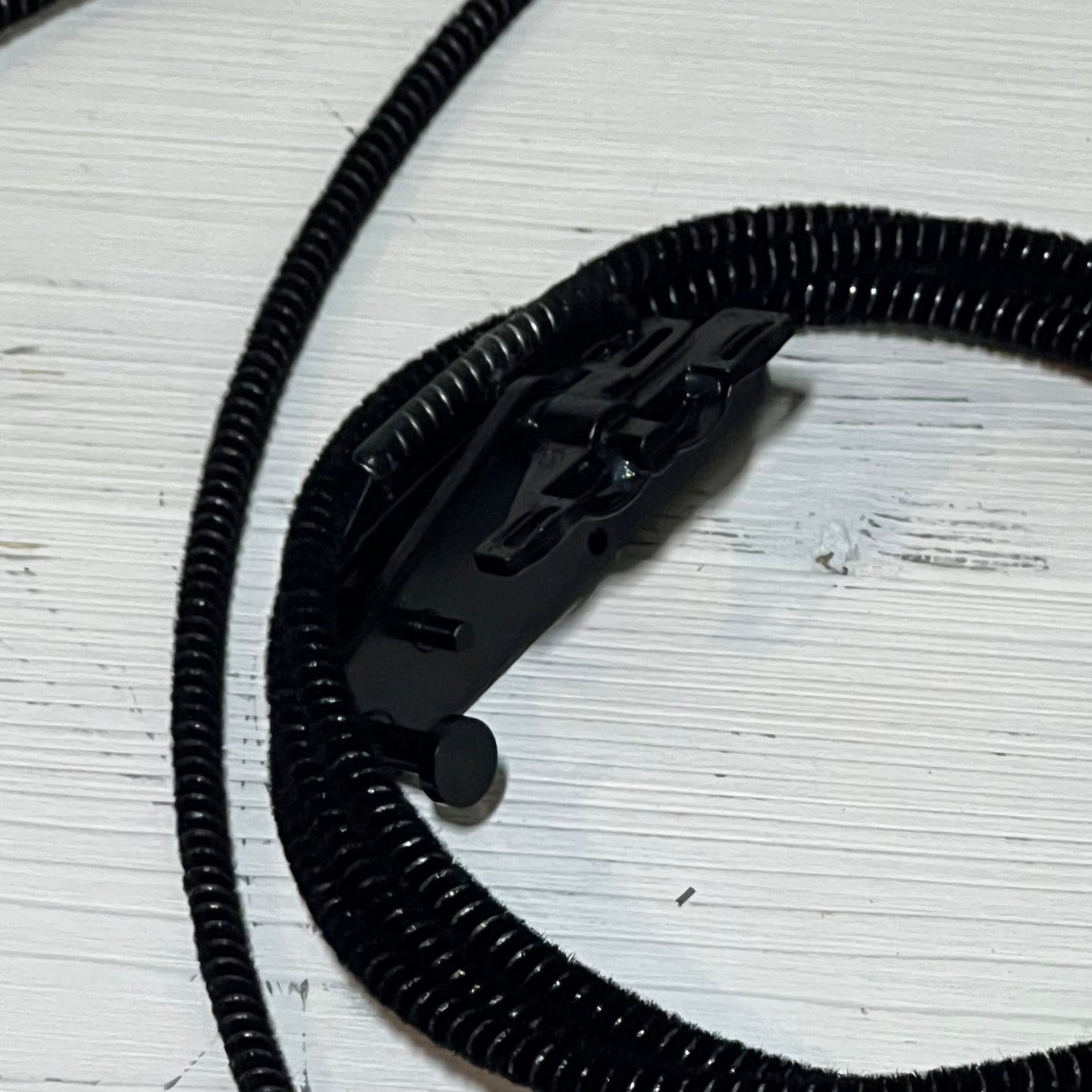 Black sunroof glass cable for Ford F150, F250, F350, F450 models, 2015-2020, with durable black coil design.