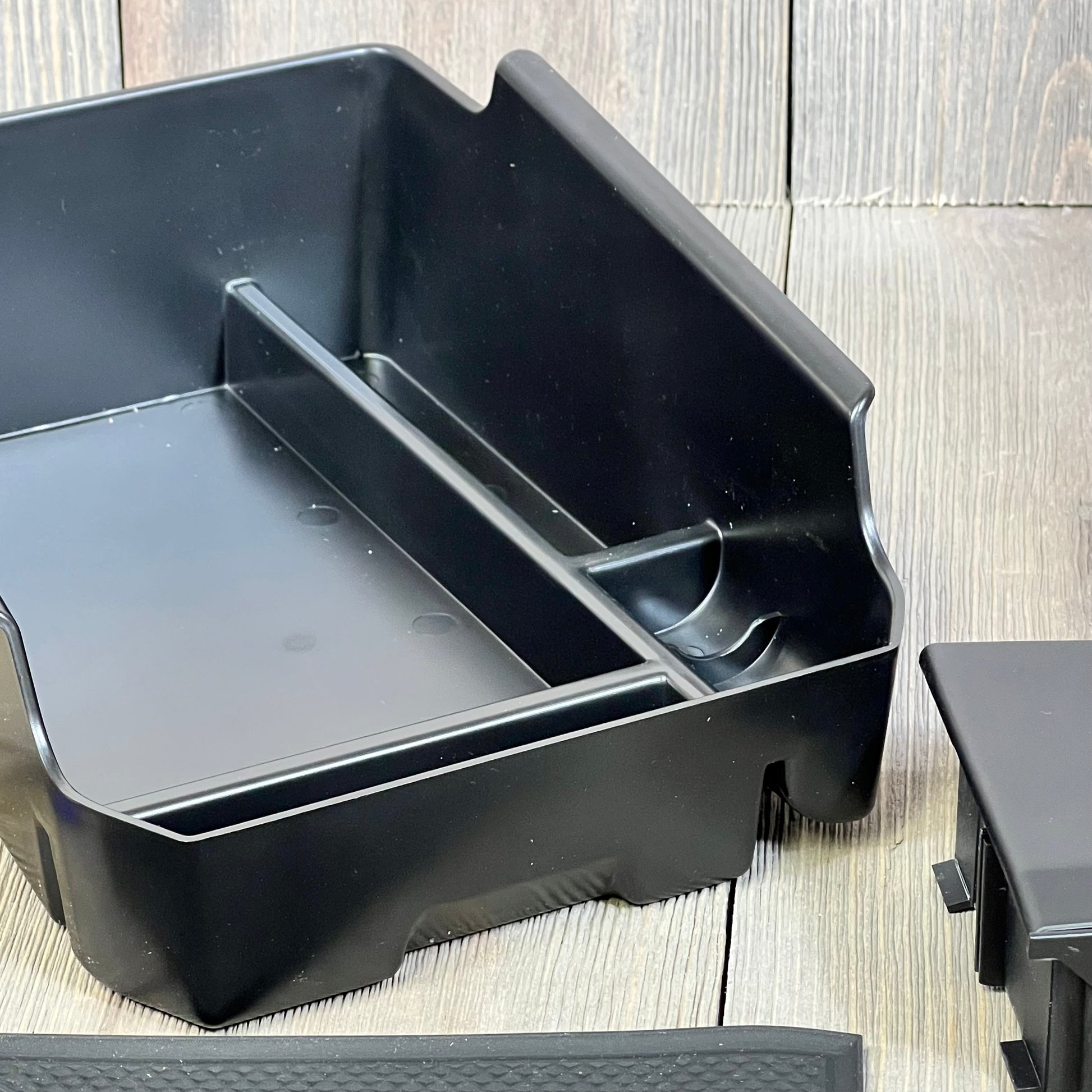 Black center console organizer tray for BMW X3 X4 2019-2023, featuring multiple compartments for efficient storage.