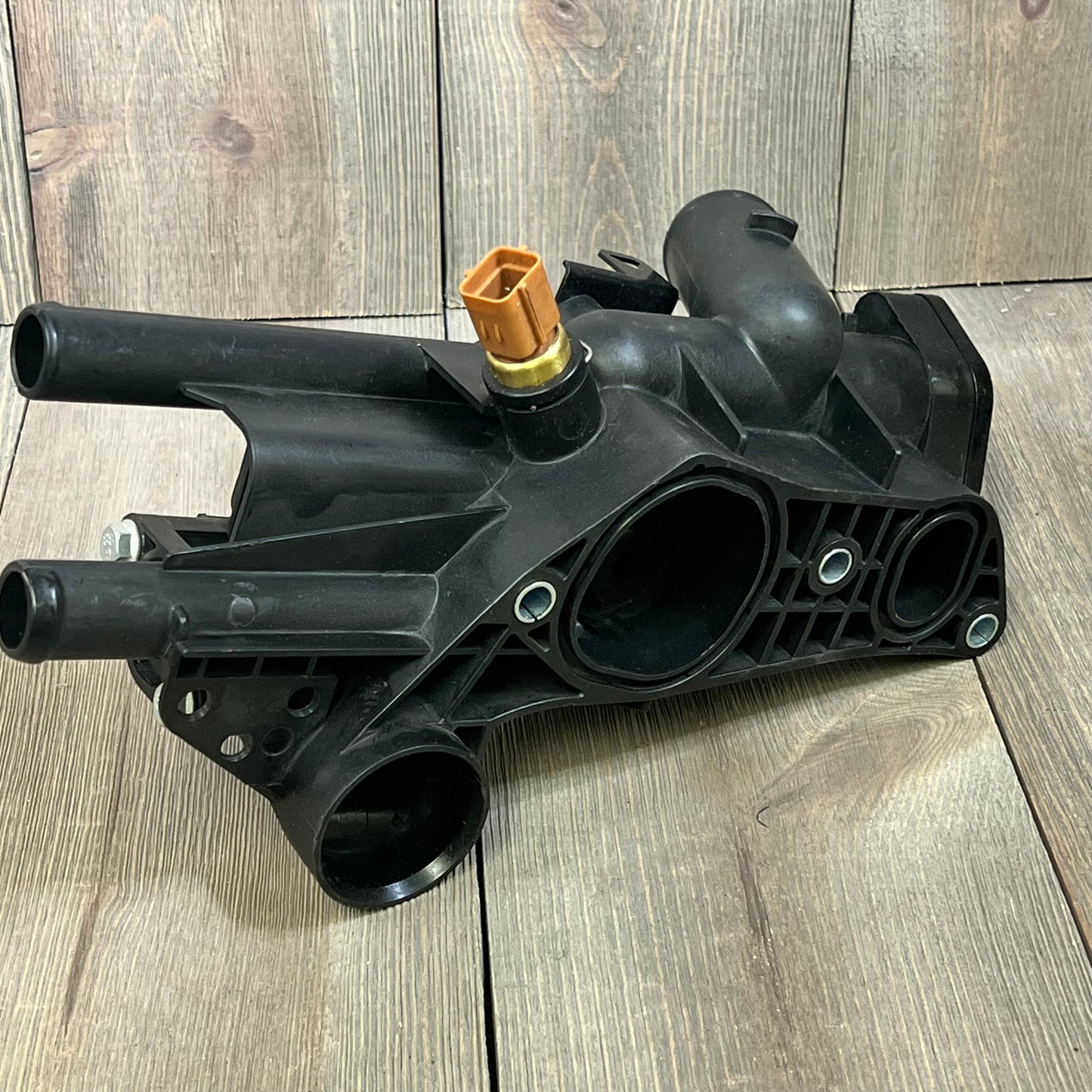 Engine coolant thermostat housing replacement for Kia Forte 2010-2013, durable black assembly with multiple ports.
